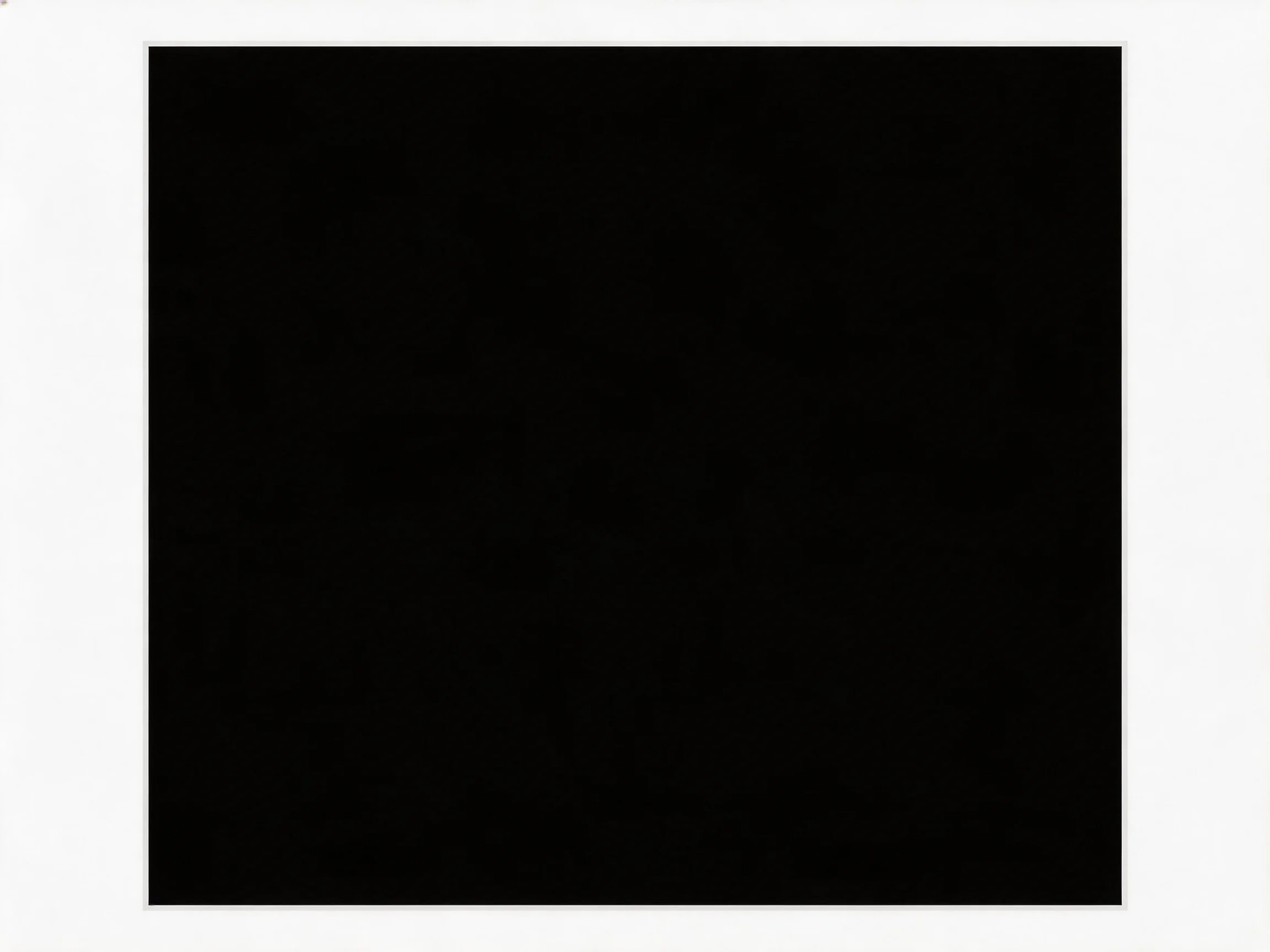 A solid black square centered on a plain white backdrop