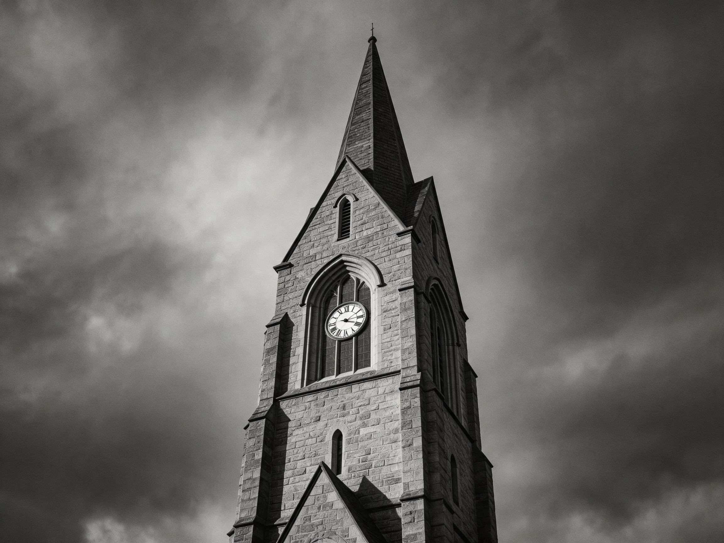 A Gothic Stone Church Tower with Clock Under Dark Stormy Skies