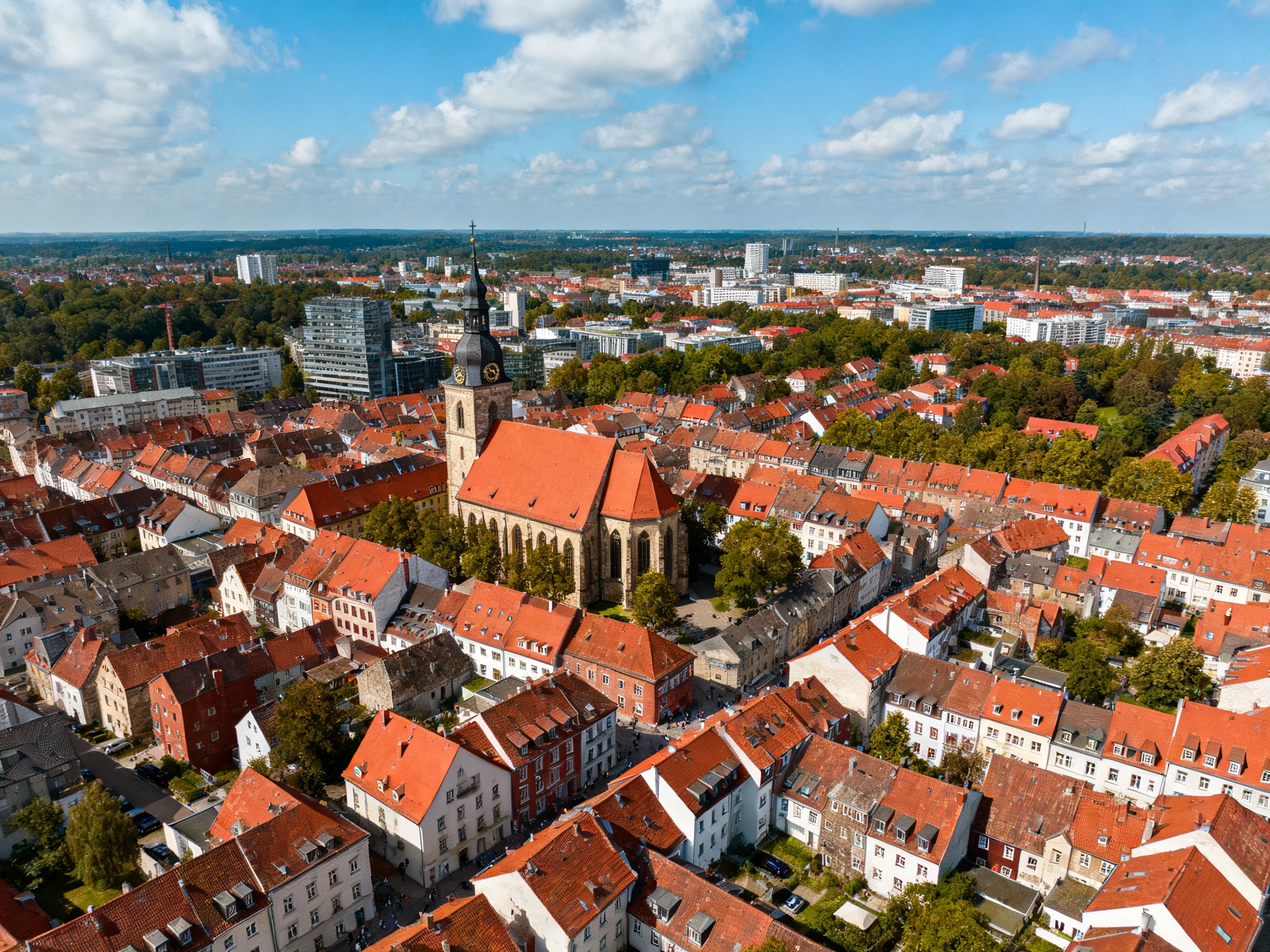 A Historic Town Center with Red-Tiled Roofs and Central Church