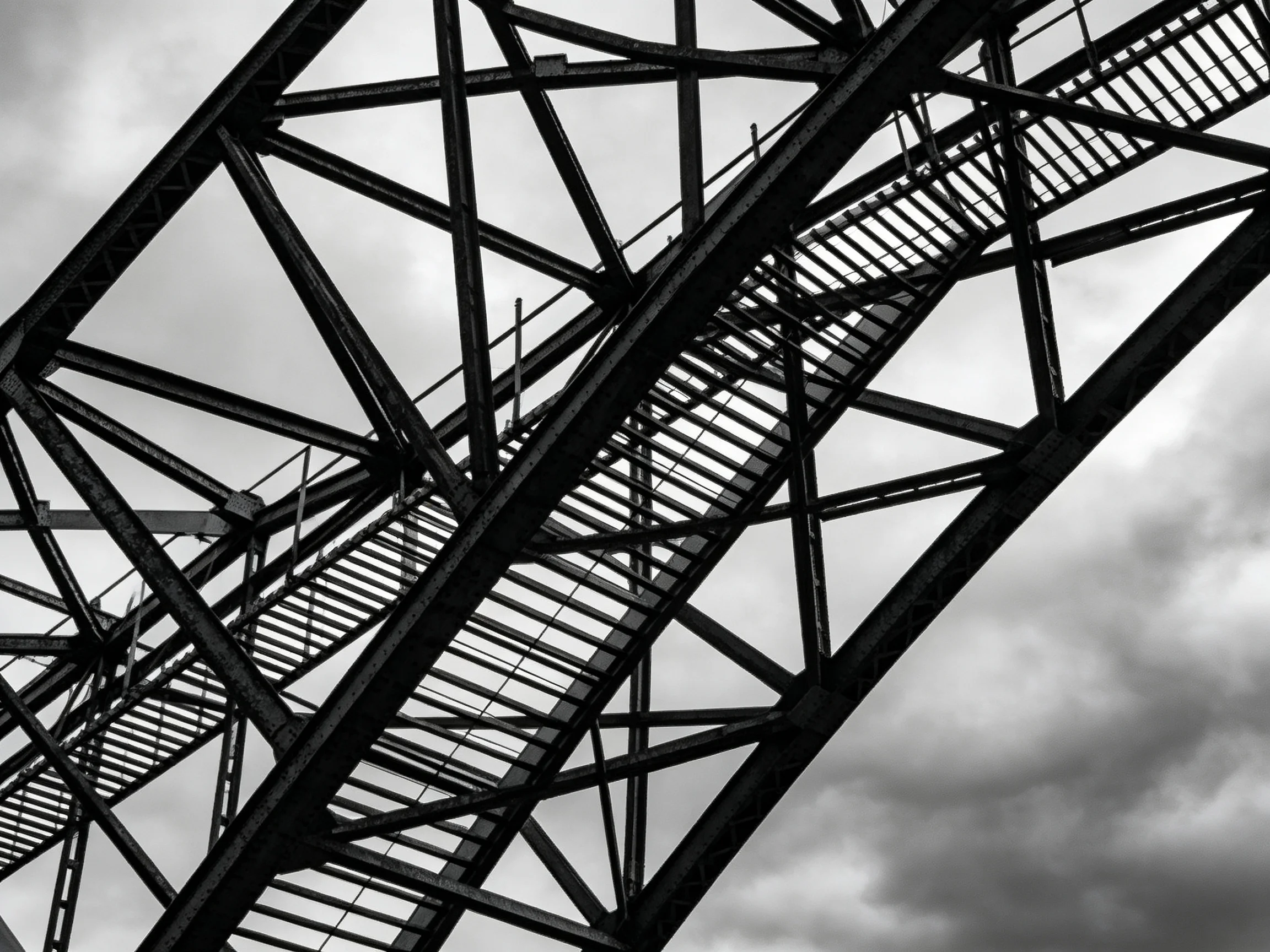 A Monochrome Steel Framework with Interlaced Staircases and Trusses