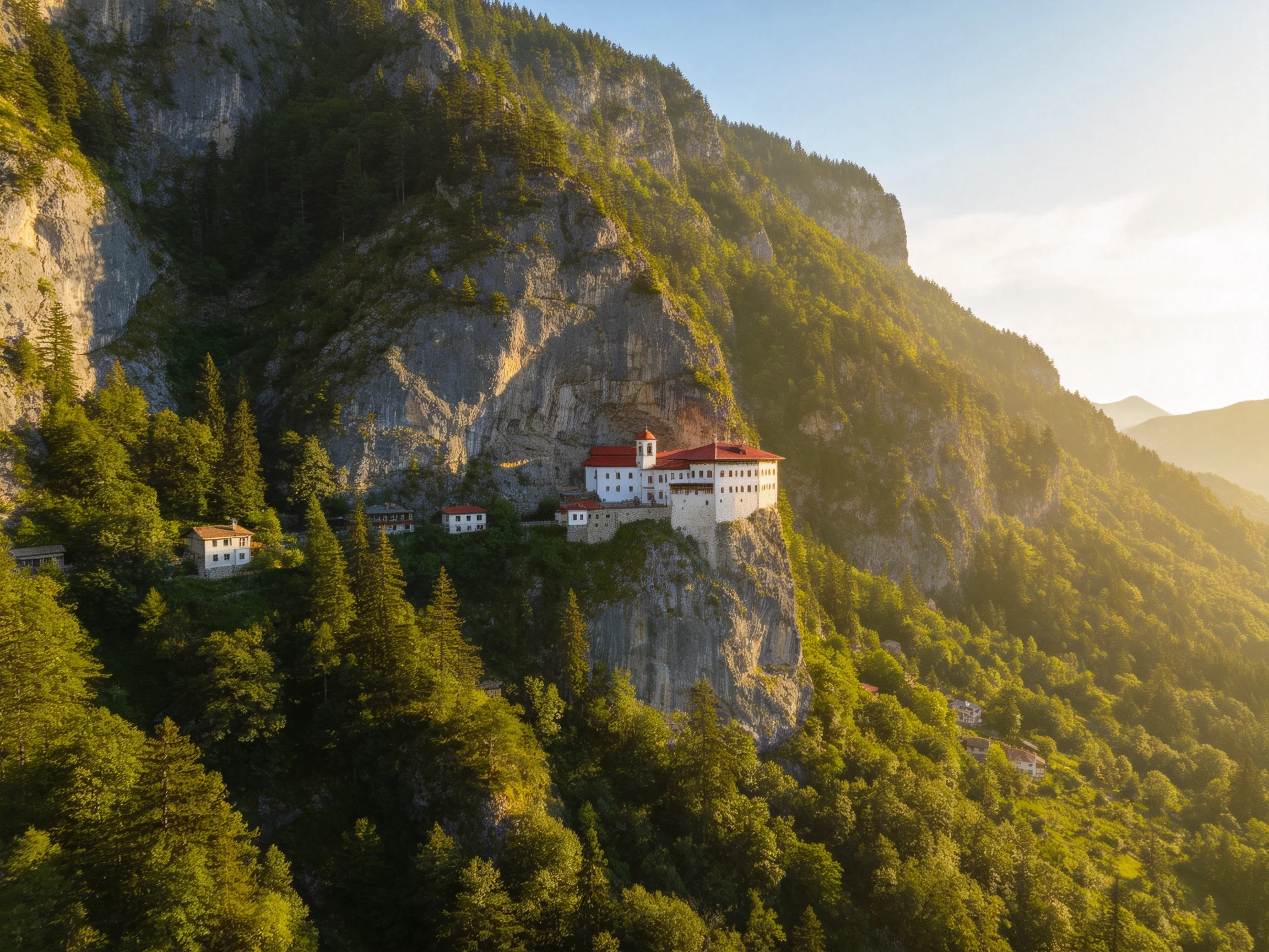 A cliffside monastery with red roofs surrounded by dense forests