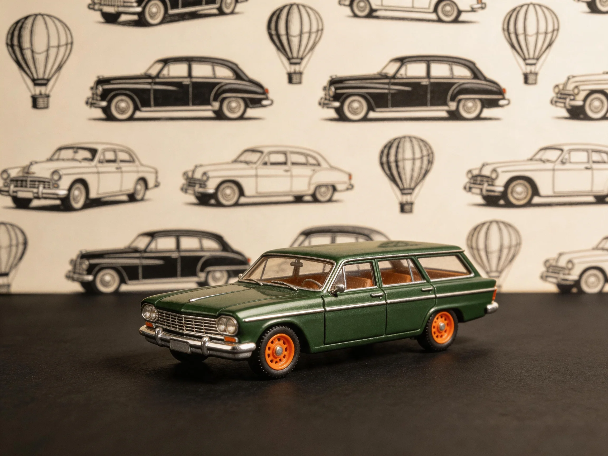 A dark green vintage station wagon model with orange wheels displayed before illustrated car wallpape