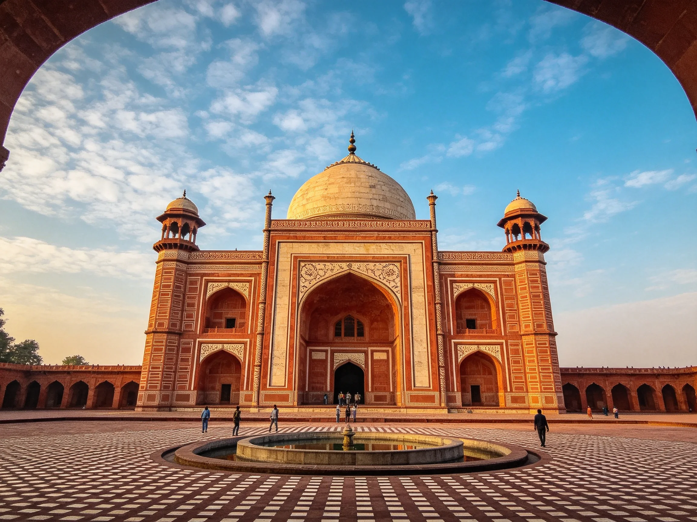 A grand red-brick mausoleum with ornate arches and domes