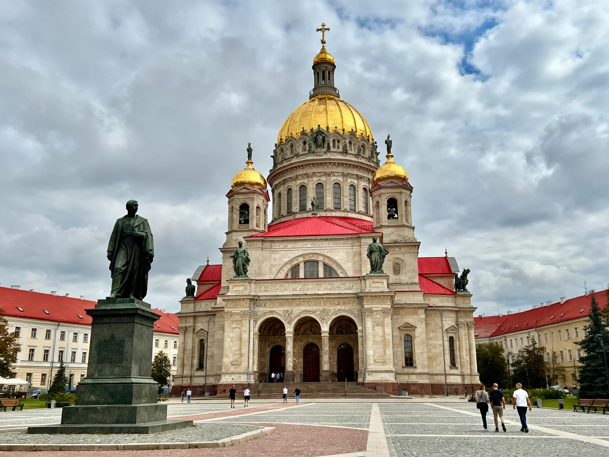 A magnificent cathedral with golden domes and red roofs