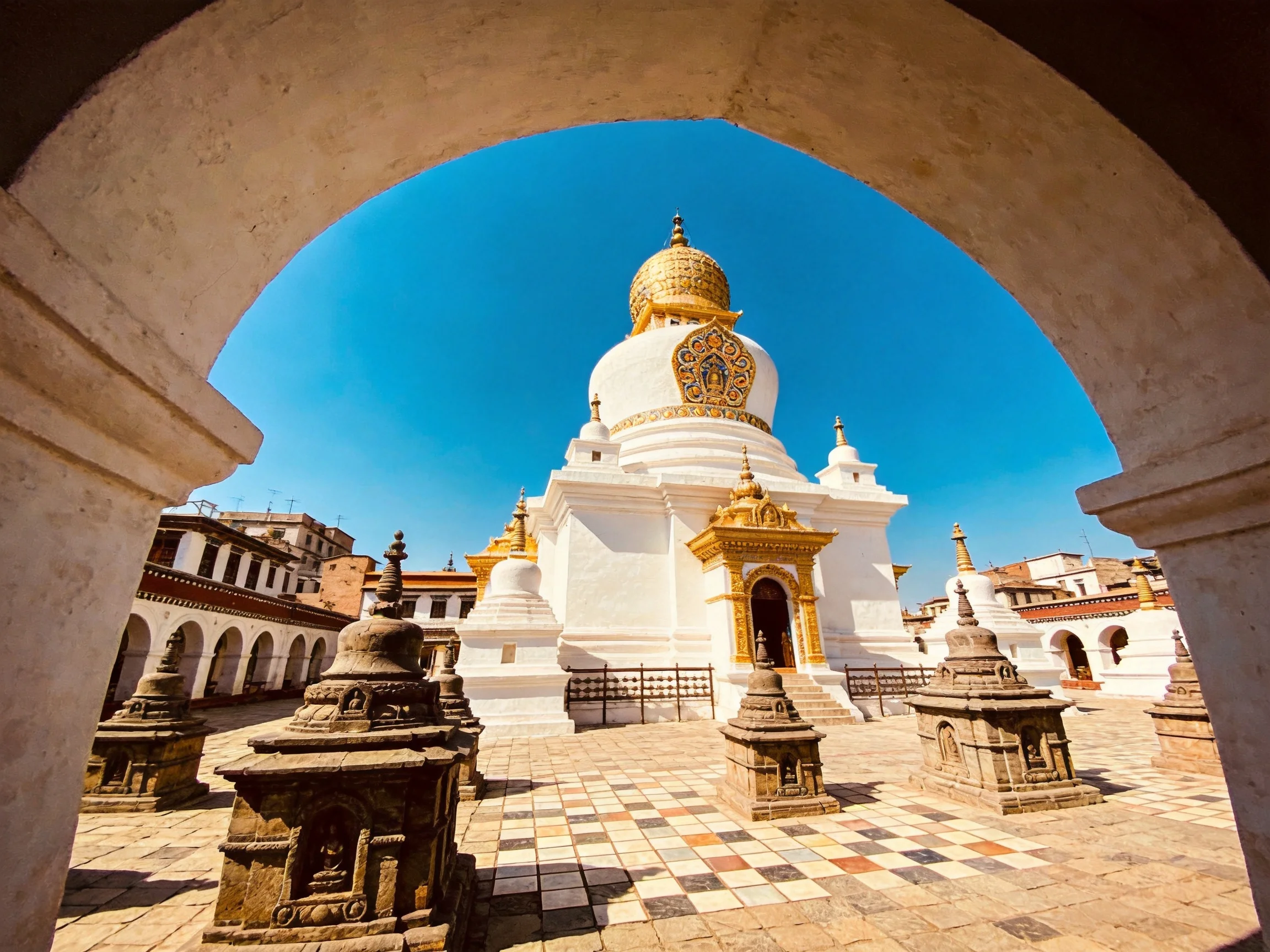 A majestic white temple with golden accents framed by an archway