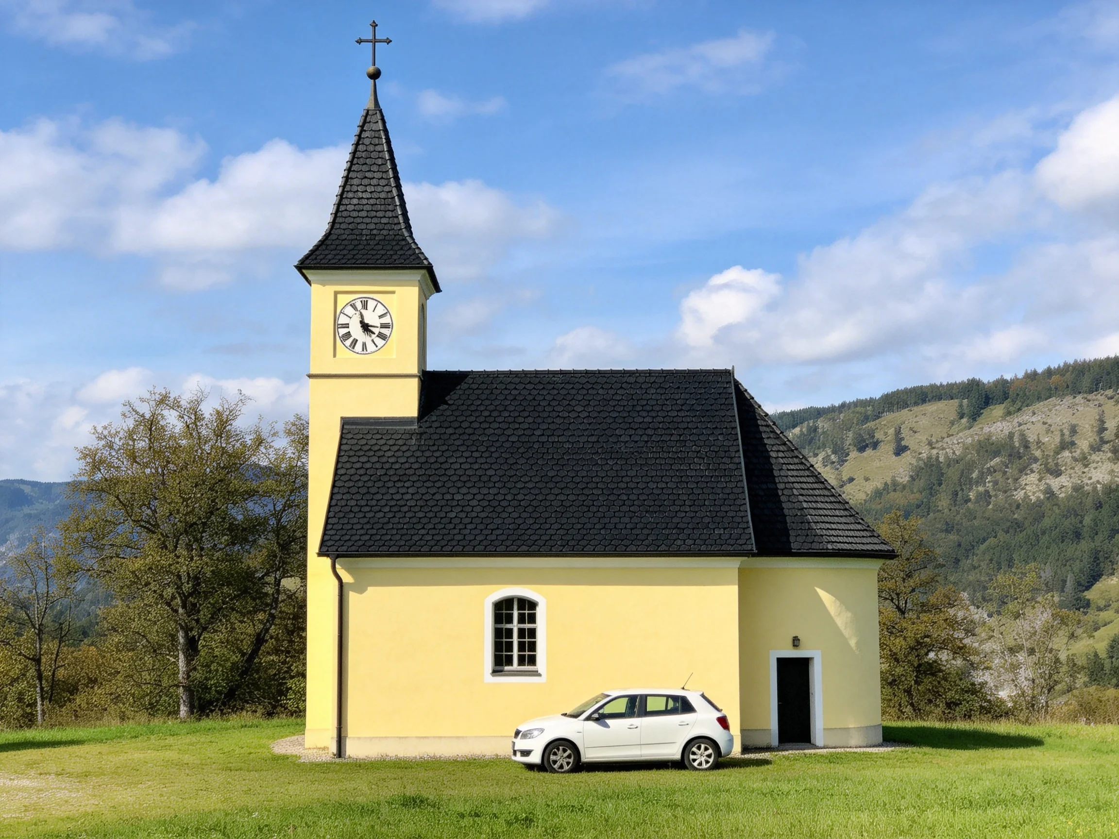 A small yellow chapel with a clock tower beside a white car