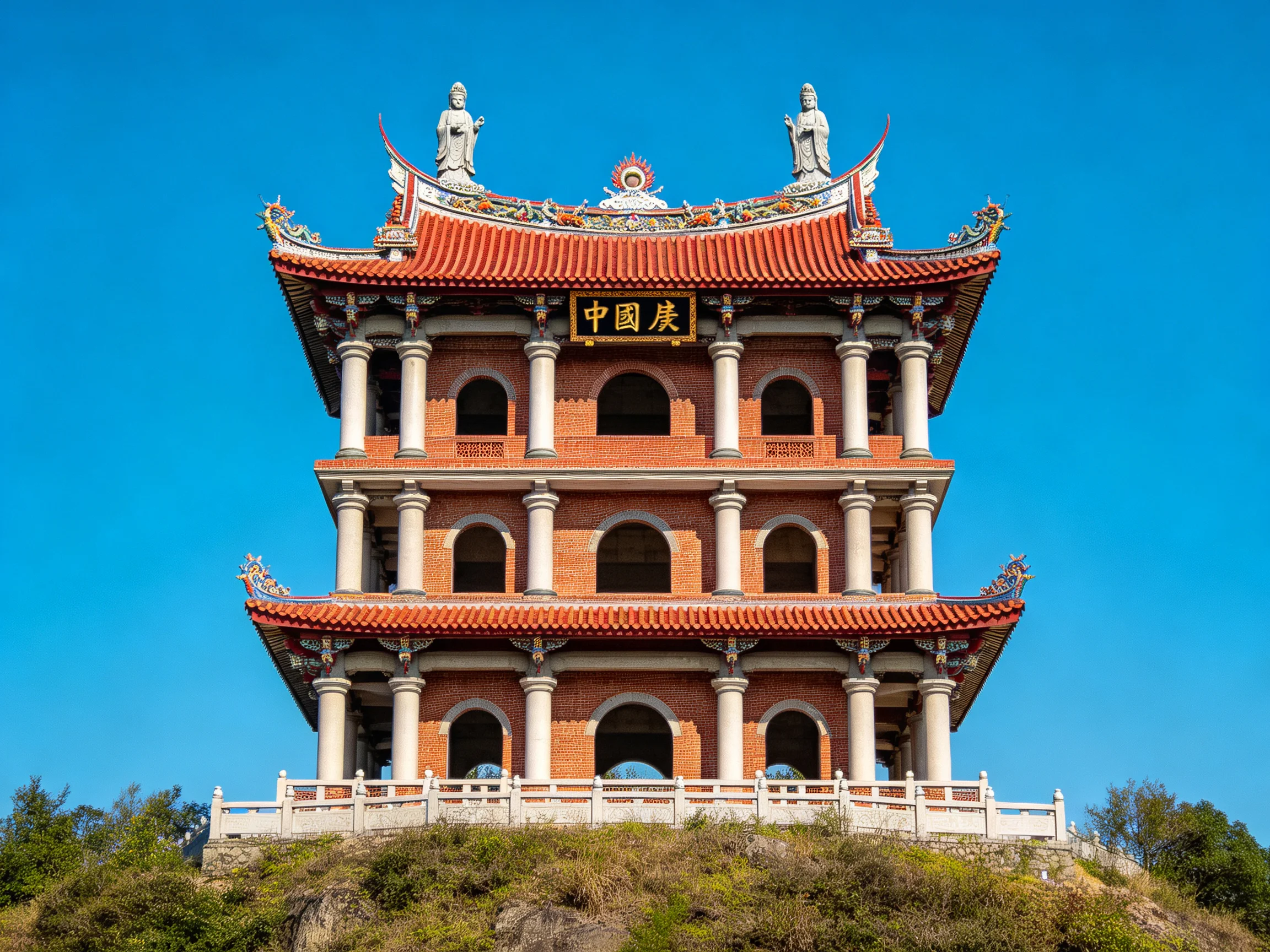 A three - tiered brick temple with red tiled roofs