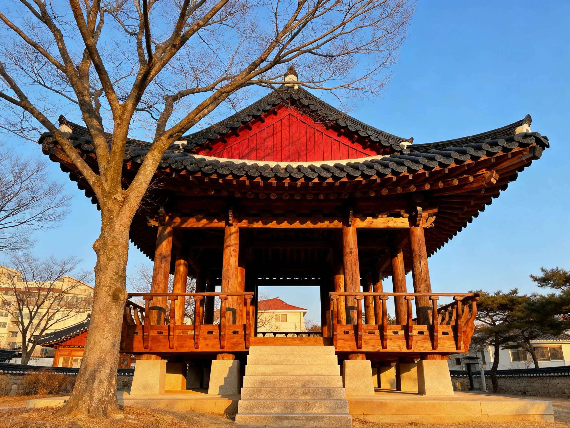 A traditional Korean pavilion with red accents and wooden architecture