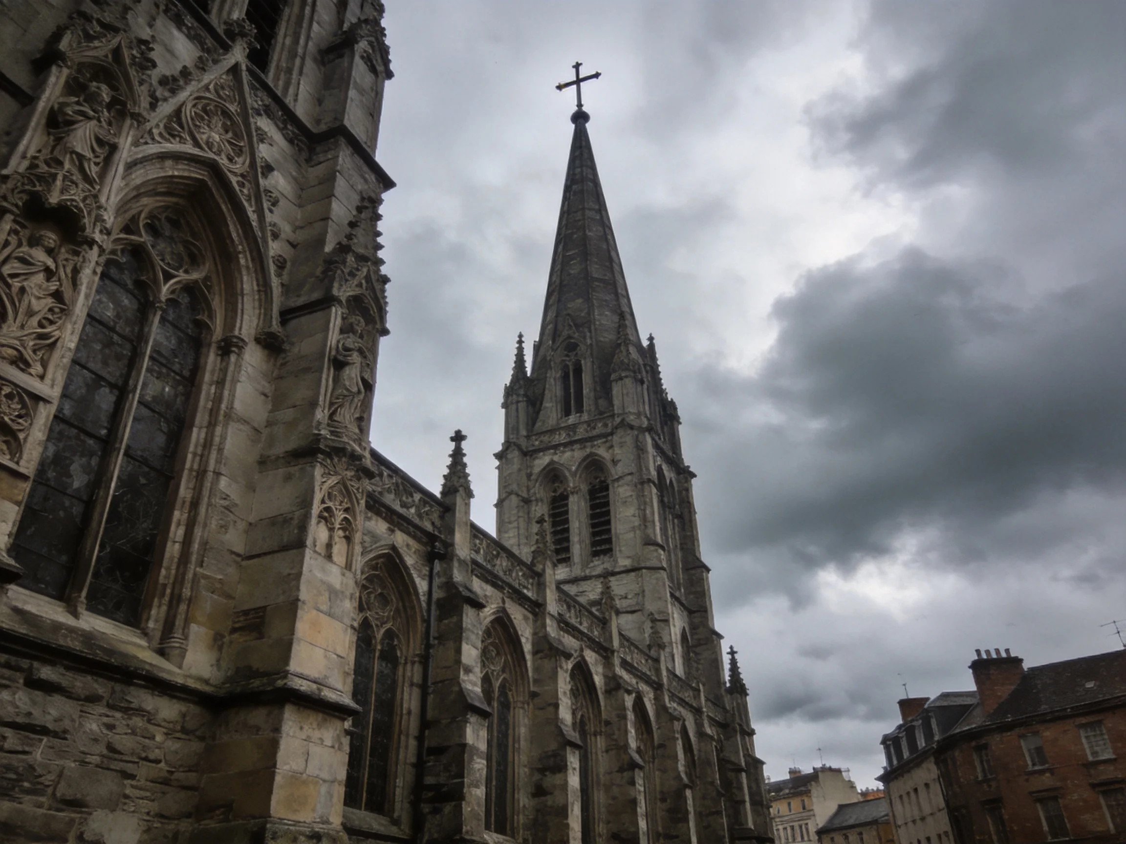 An aged stone cathedral with tall spire under gloomy skies