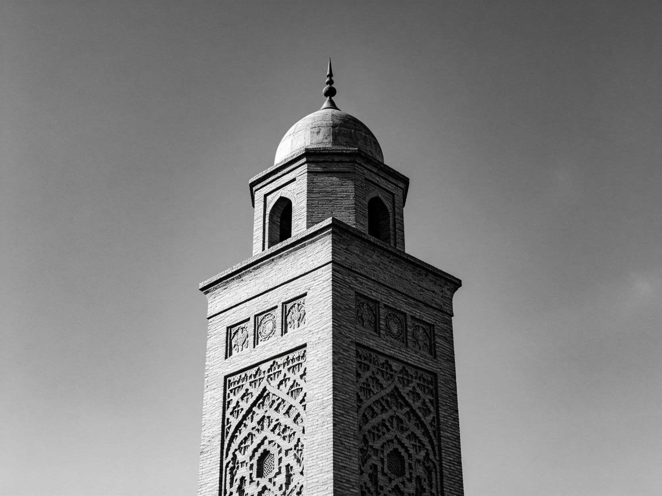 An intricately carved brick tower with a domed top