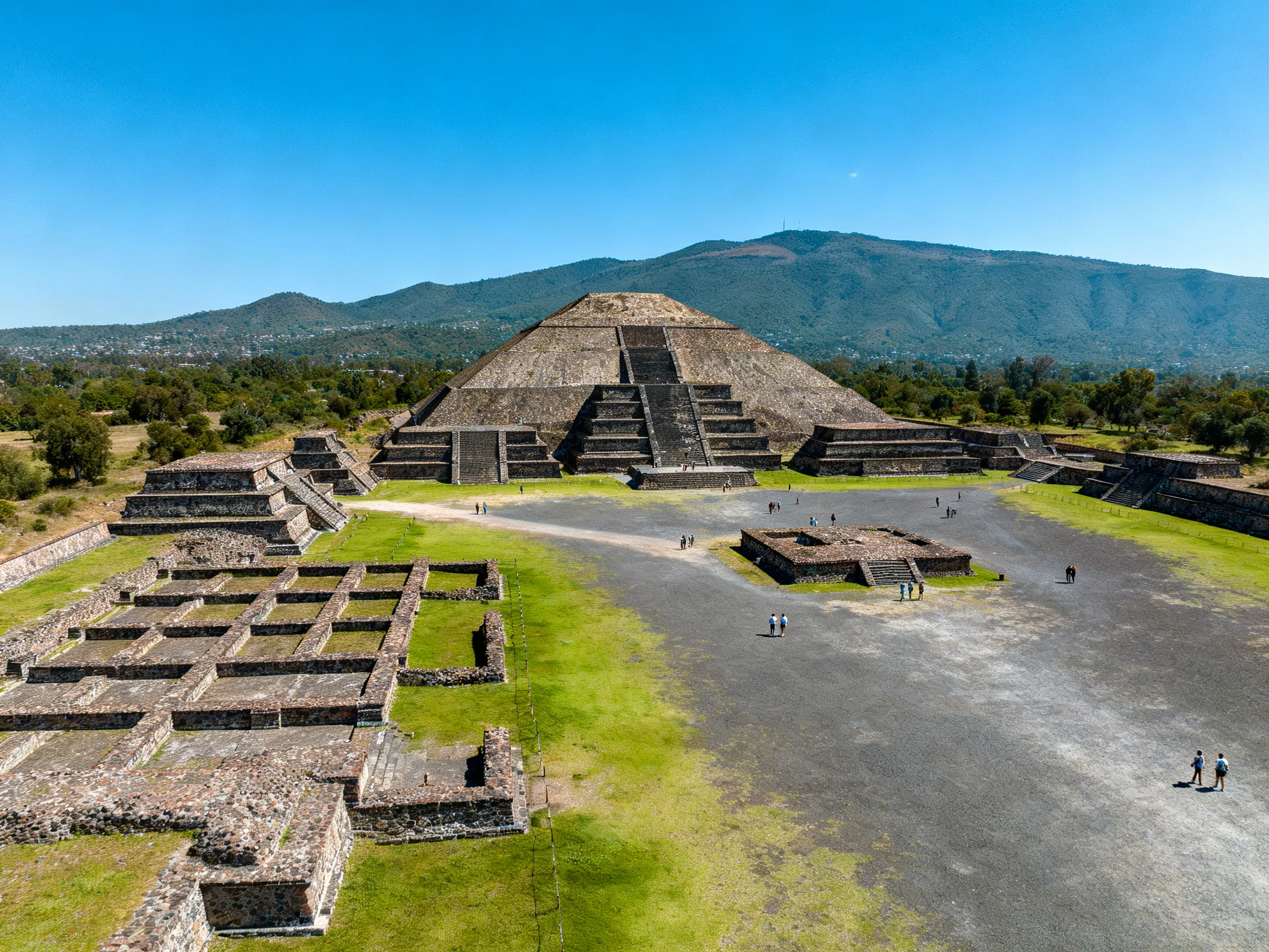 Ancient Pyramid Ruins with Green Fields and Blue Sky
