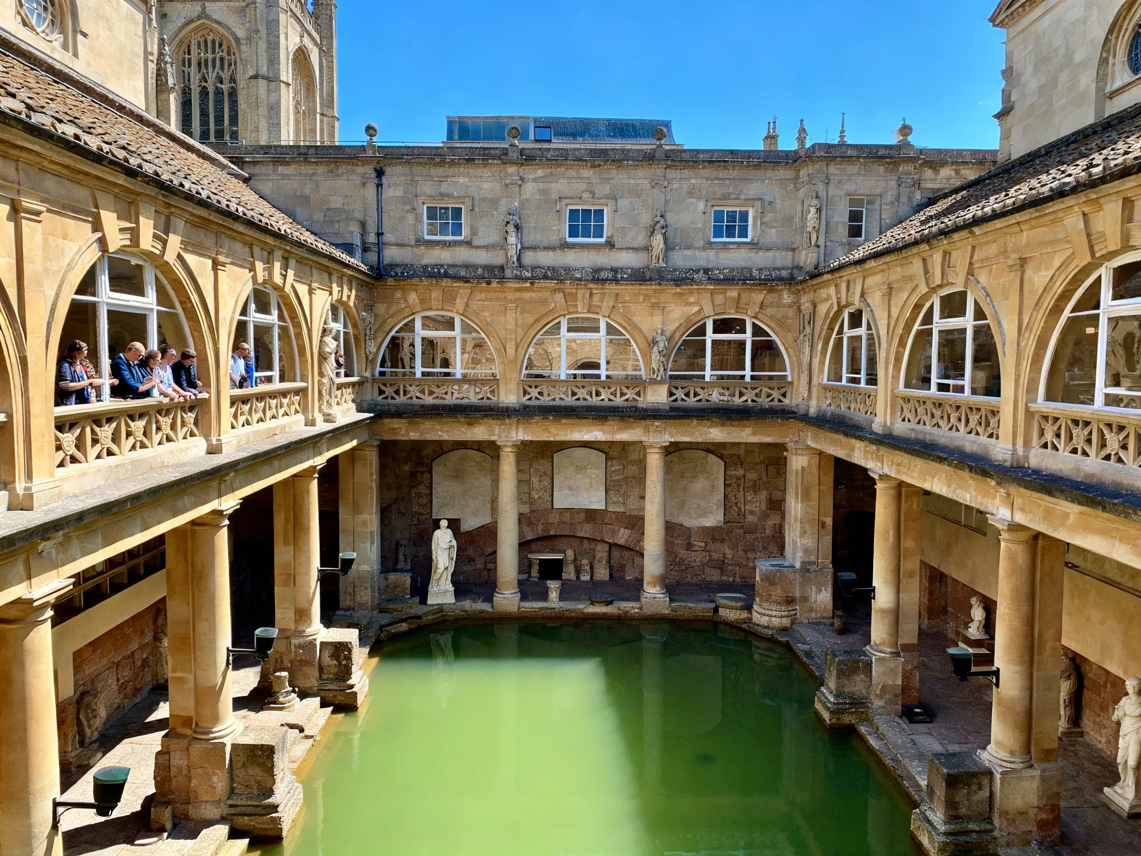 Ancient Roman Baths with Arched Walkways and Green Pool