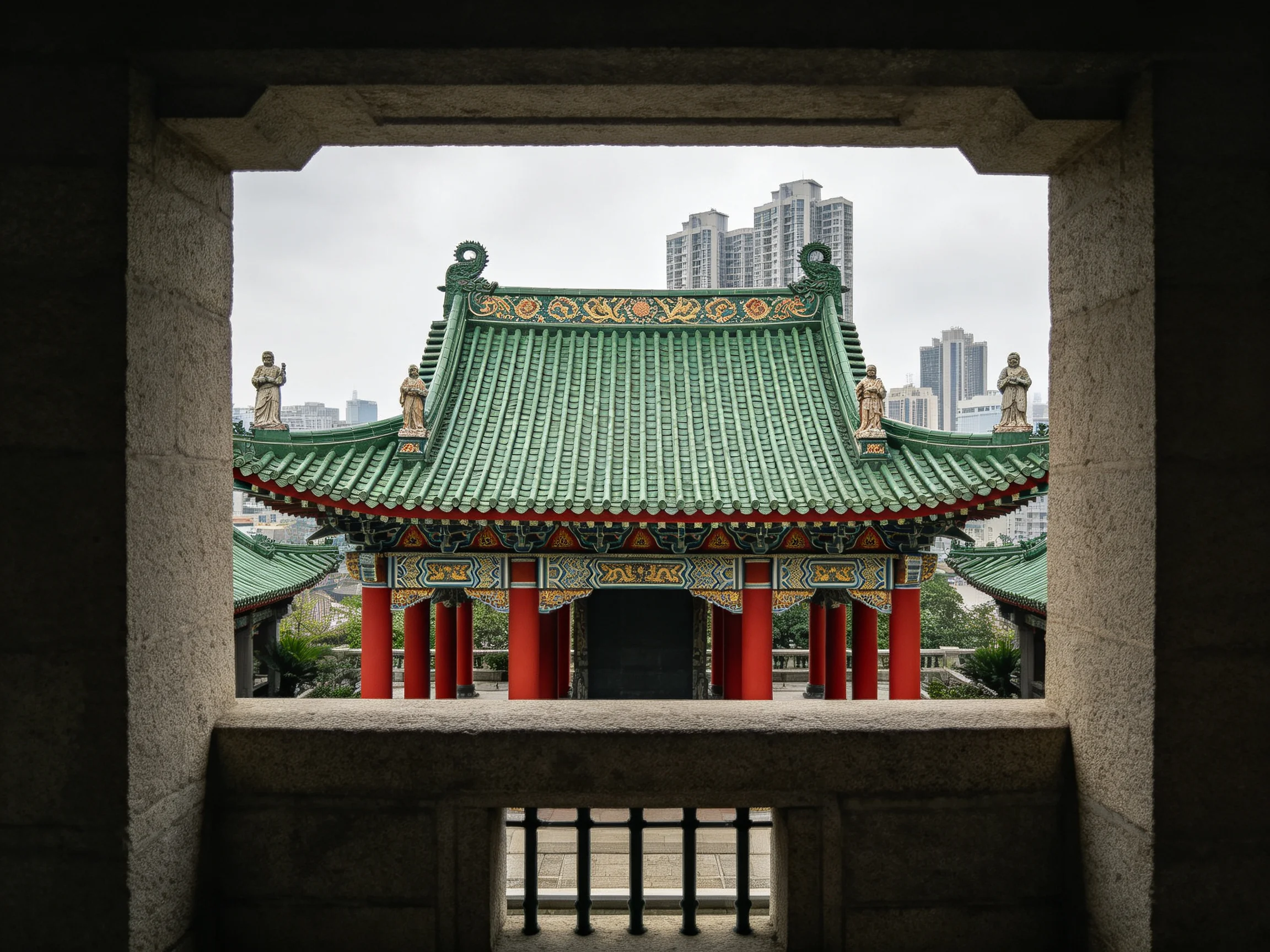 Ancient stone frame frames traditional temple with green roof and red pillars