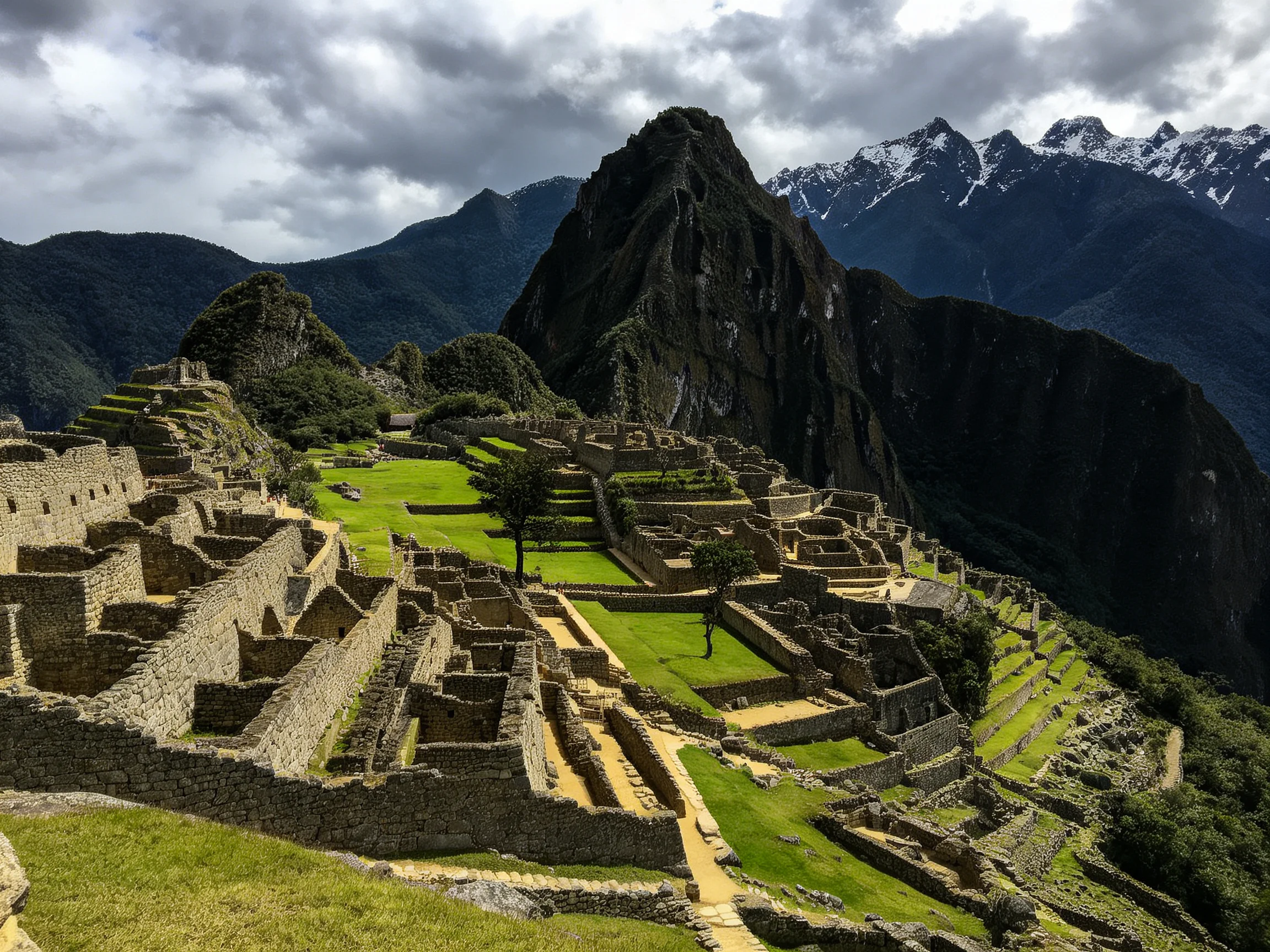 Ancient stone ruins with green terraced fields and mountain peaks