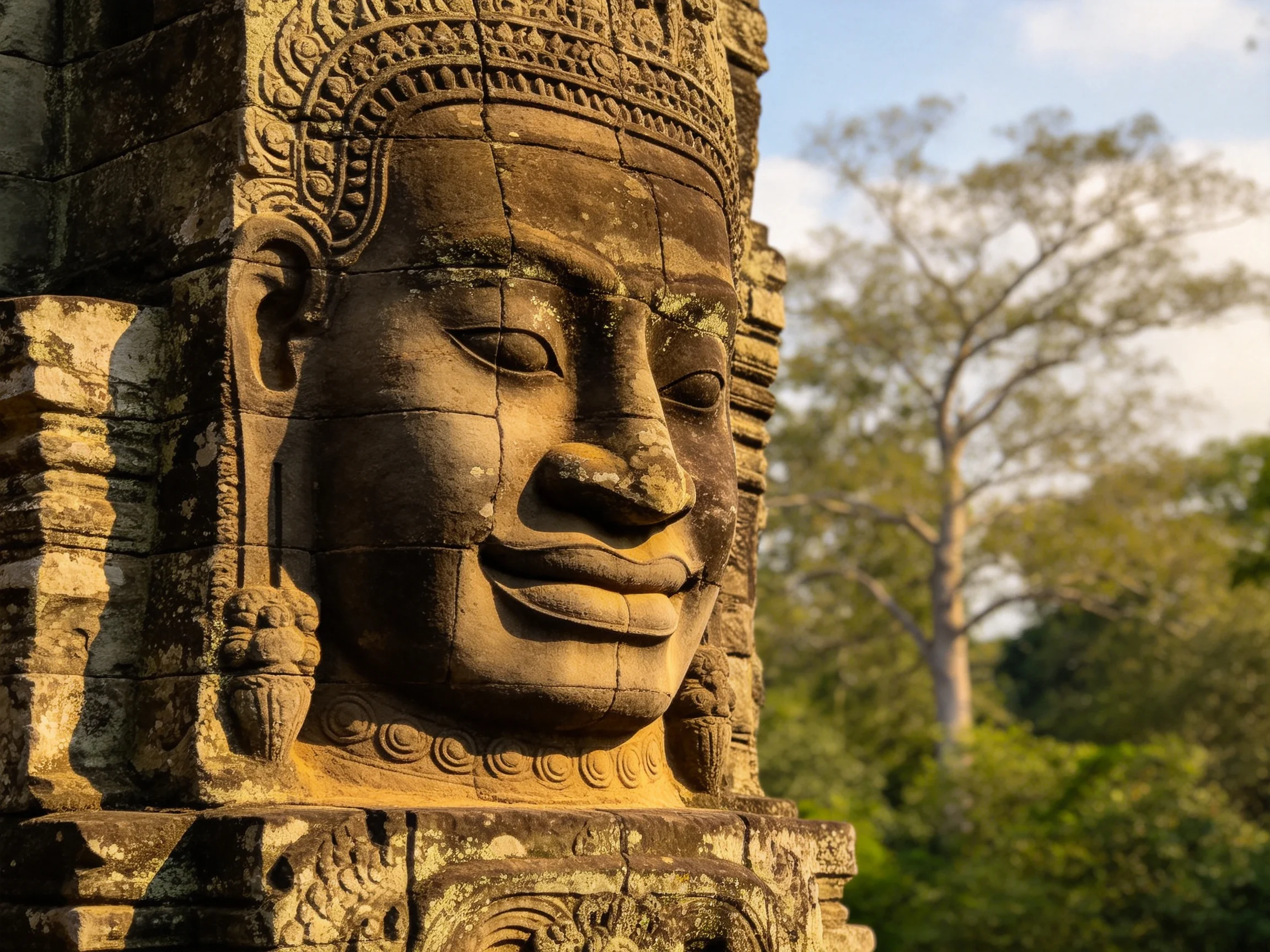 Ancient stone sculpture with weathered brown facade near lush green trees