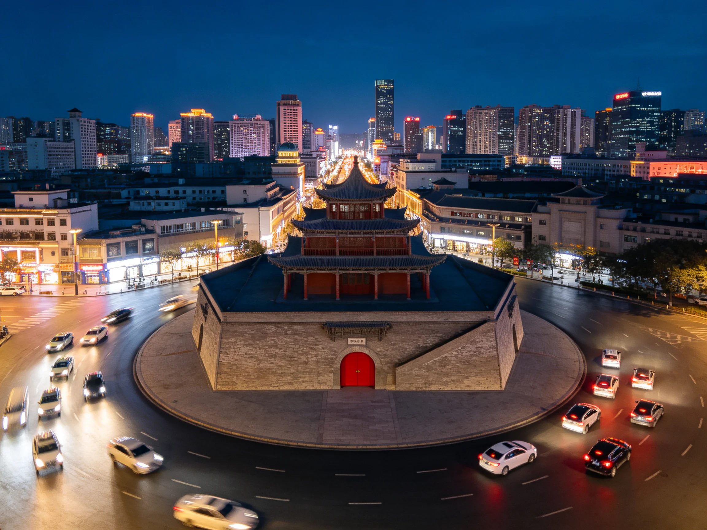 Ancient tower amid modern city streets under evening lights