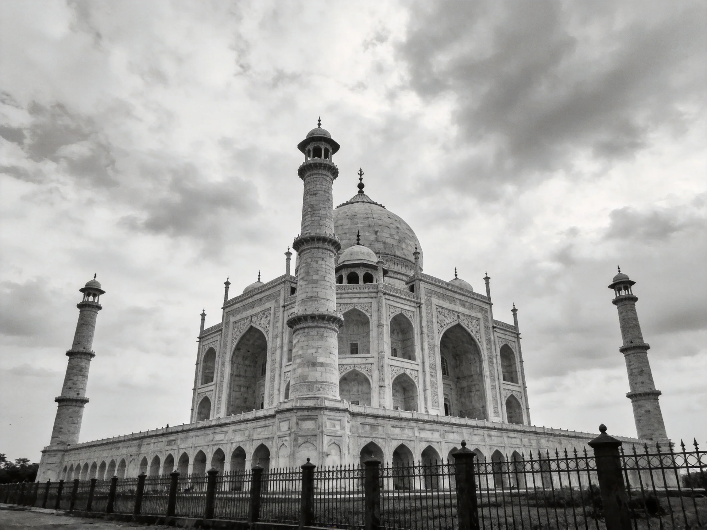 Black-and-white Taj Mahal with four minarets