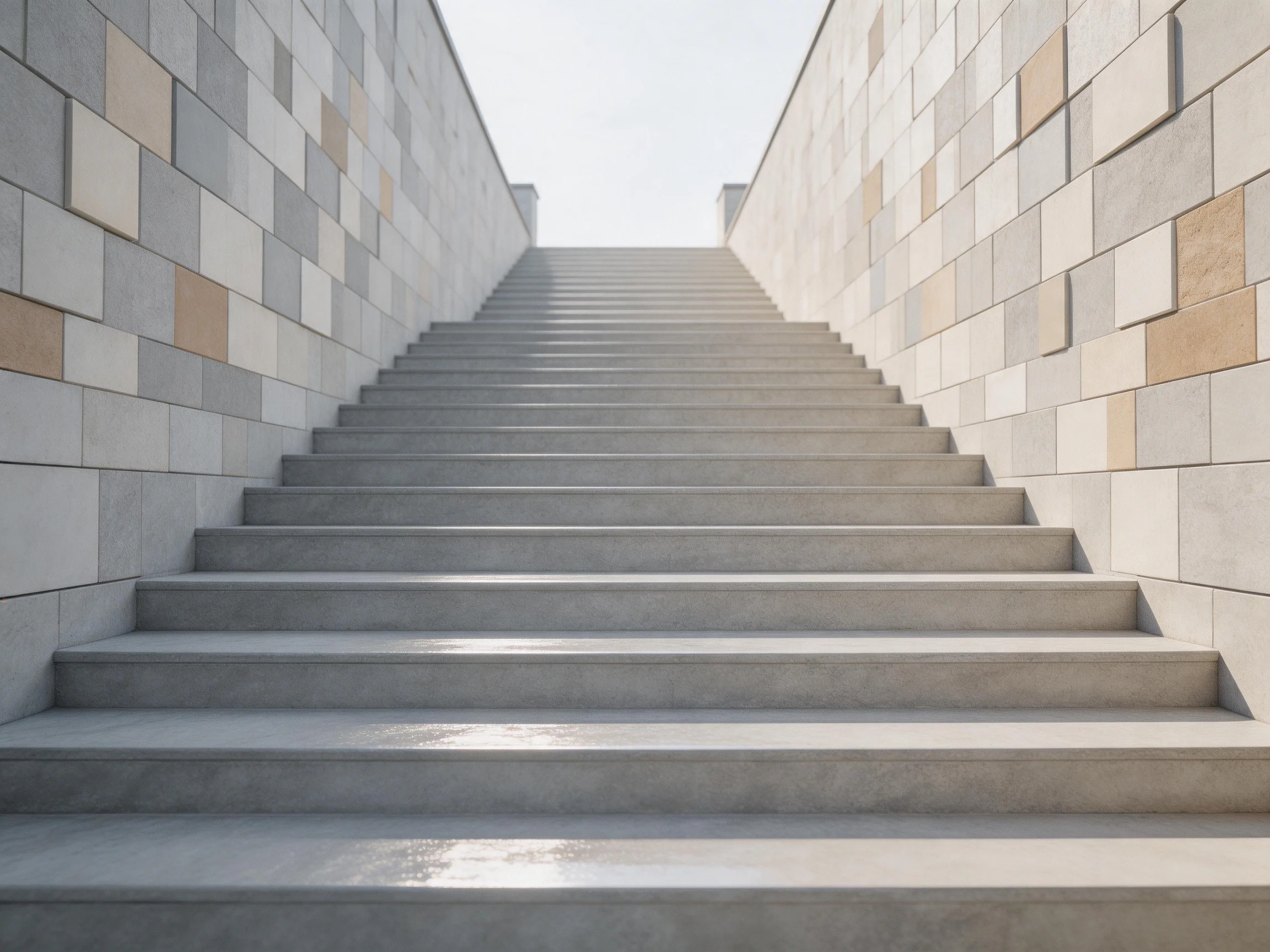 Concrete stairs flanked by multicolored stone walls under bright daylight