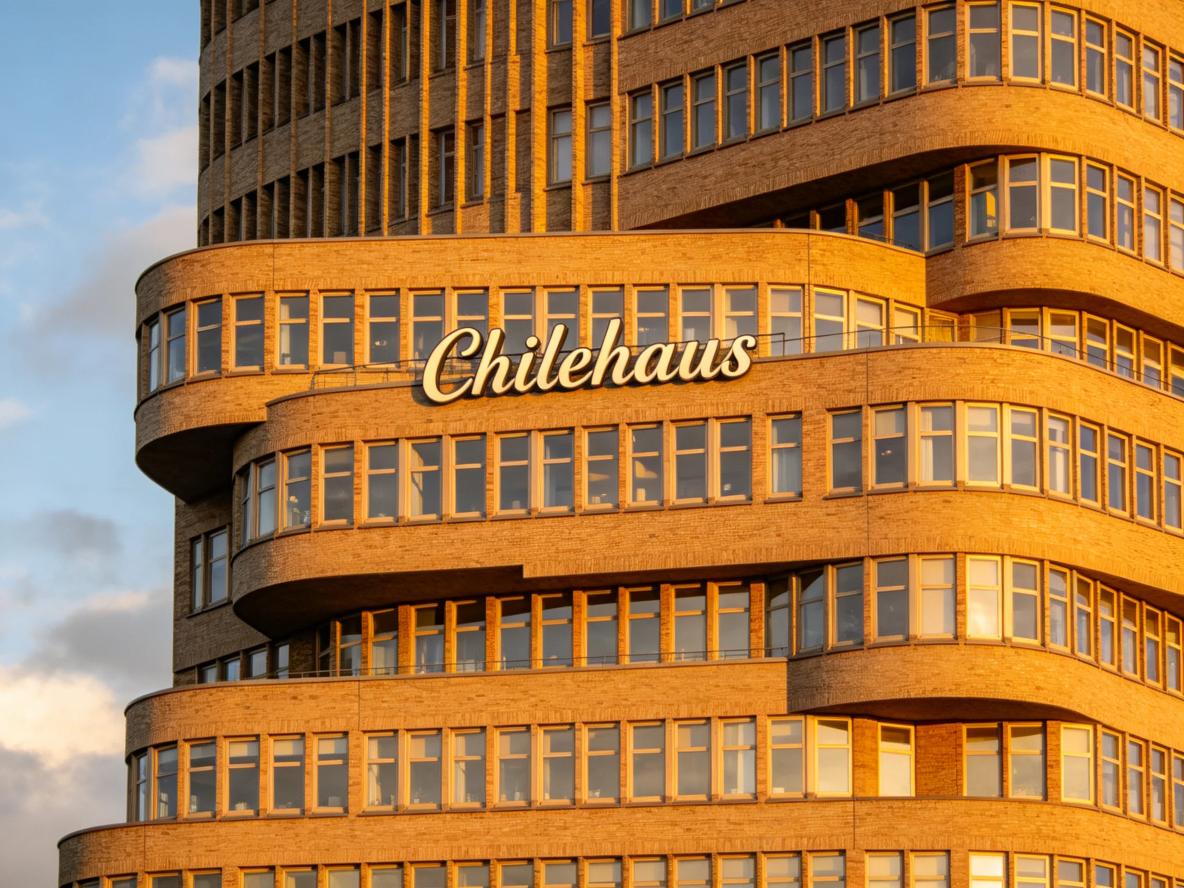 Curved Brick Architecture of Chilehaus with Golden Signage