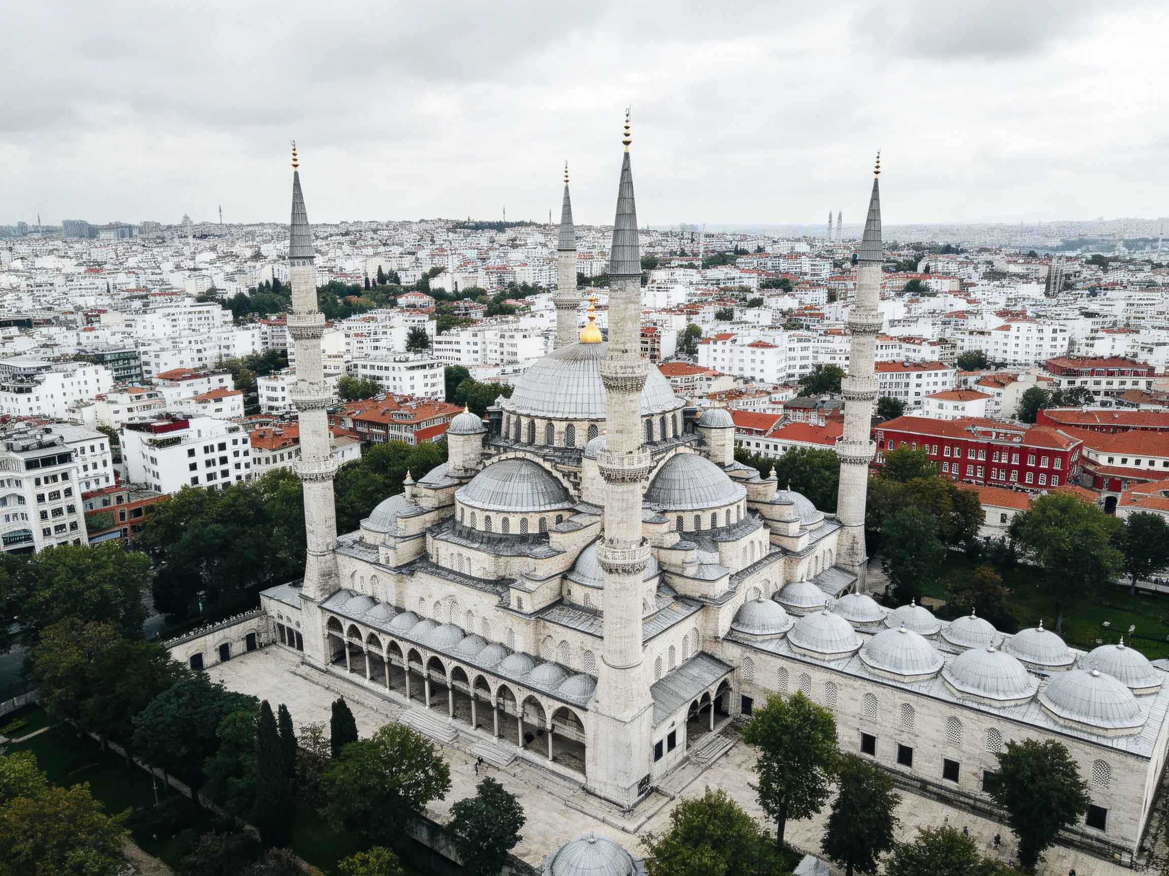 Four Minaret Mosque with Gray Domes in Cityscape