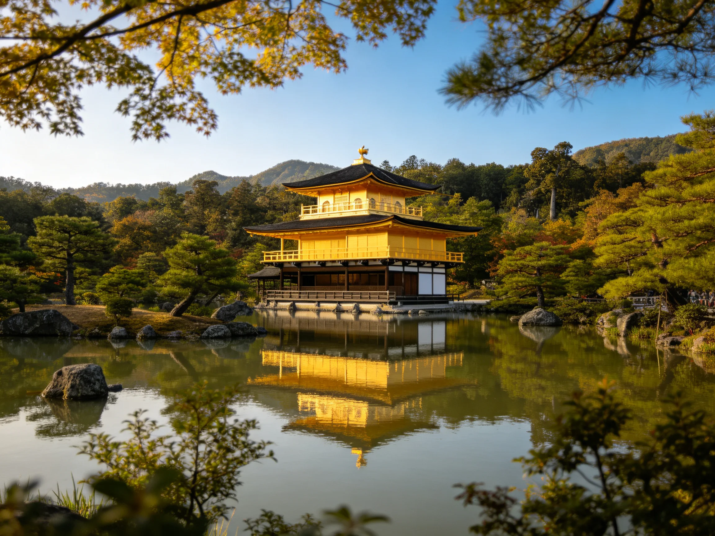 Golden Pagoda Reflecting in Serene Pond Amongst Lush Greenery