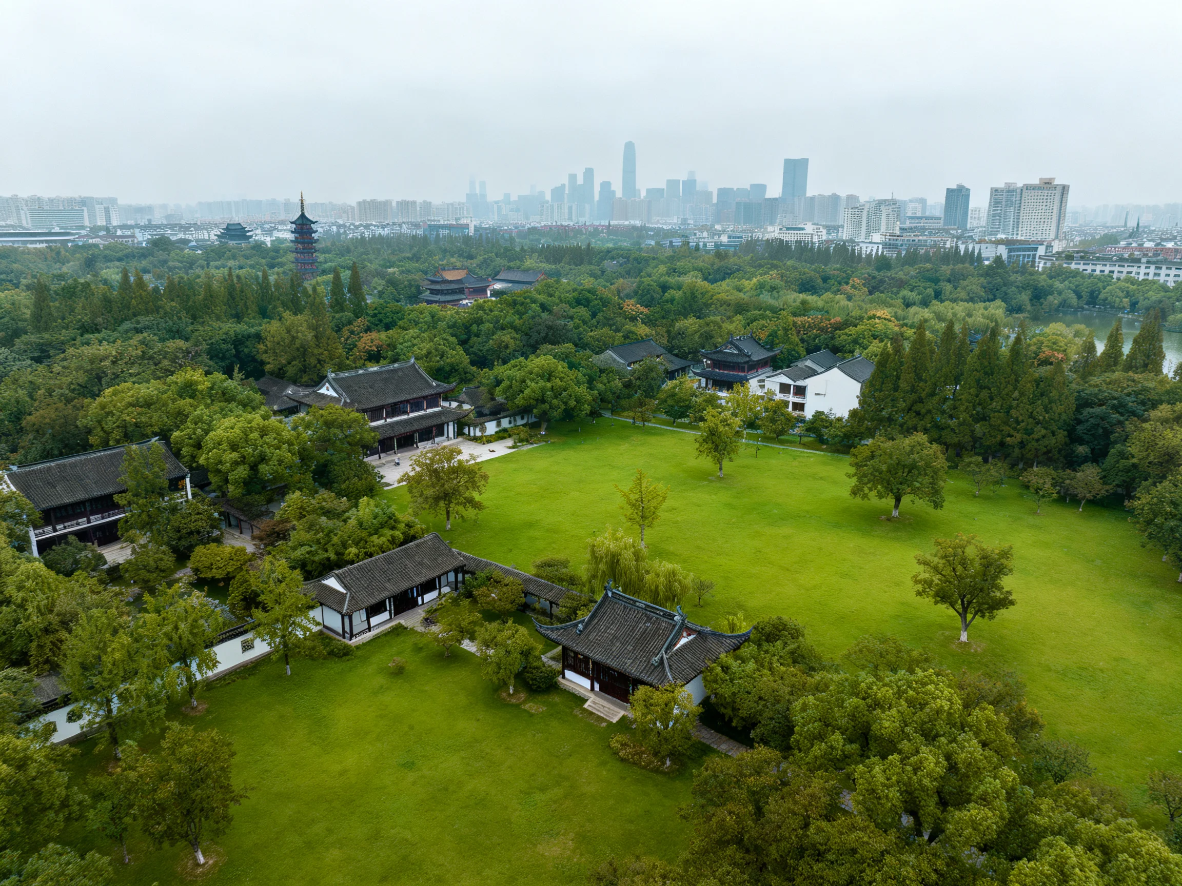 Historic Gardens with Lush Greenery Near Modern Skyscrapers