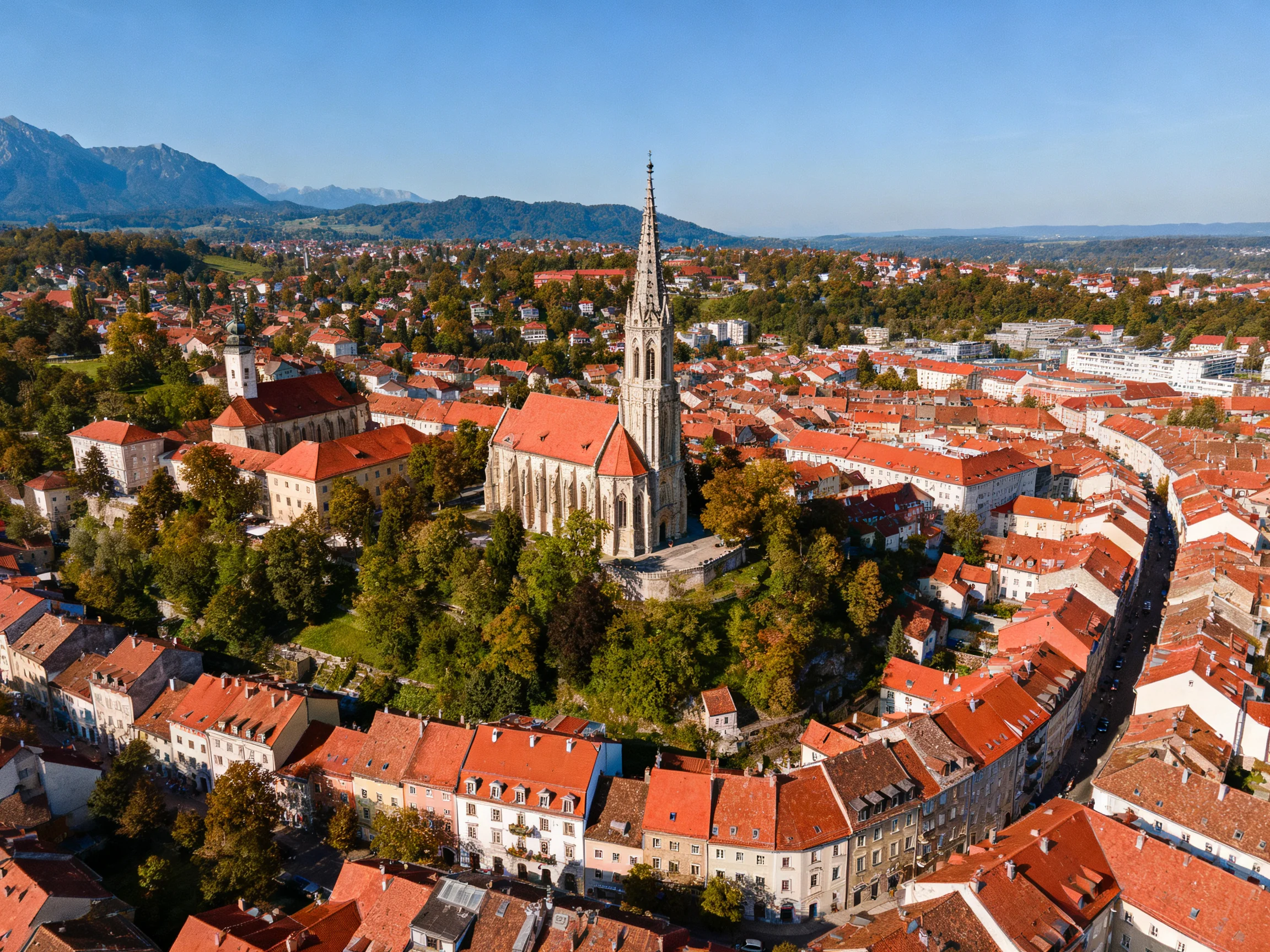 Historic town with red-tiled roofs and central cathedral tower