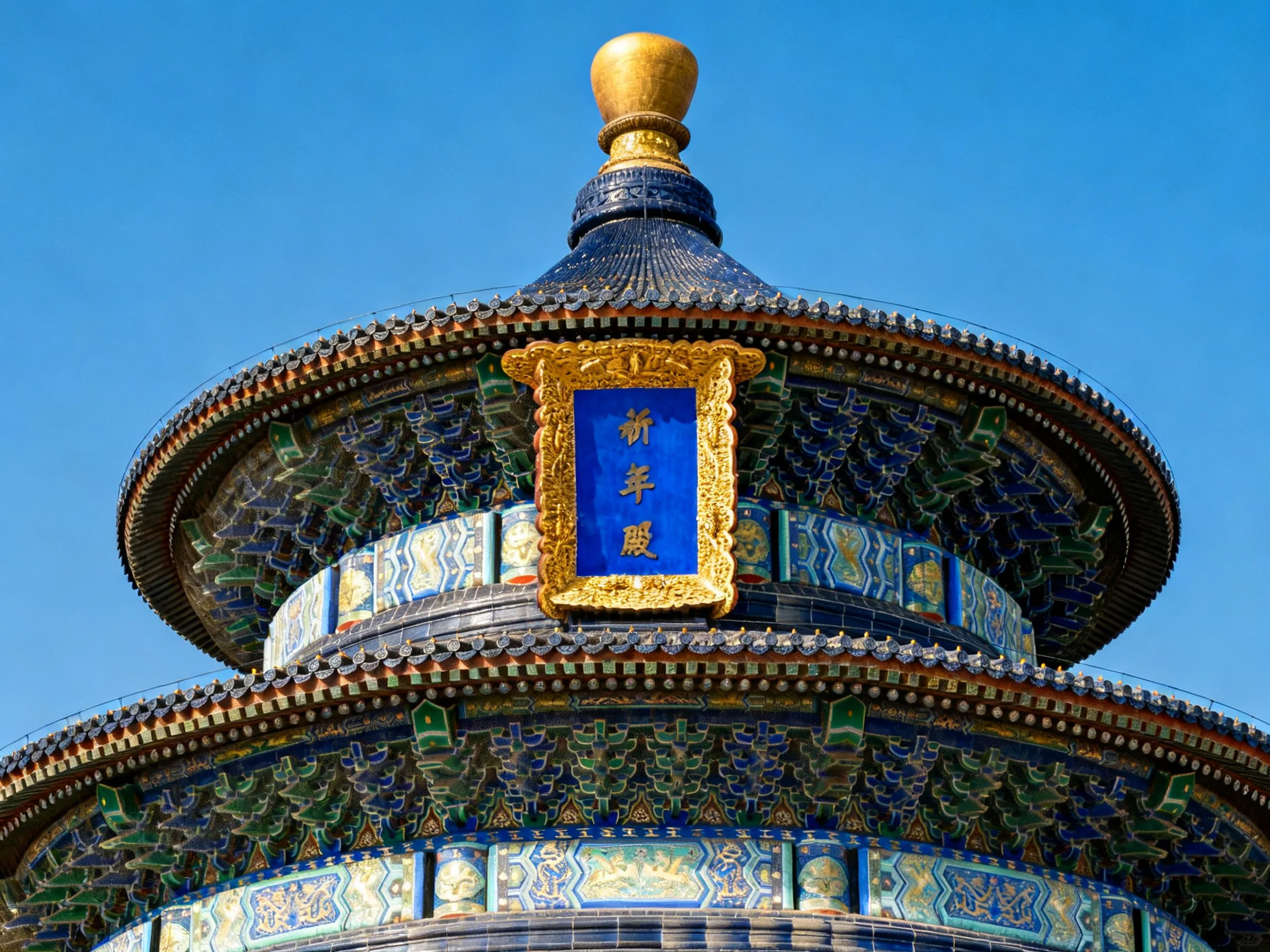 Ornate multi-tiered temple with vibrant blue and gold detailing
