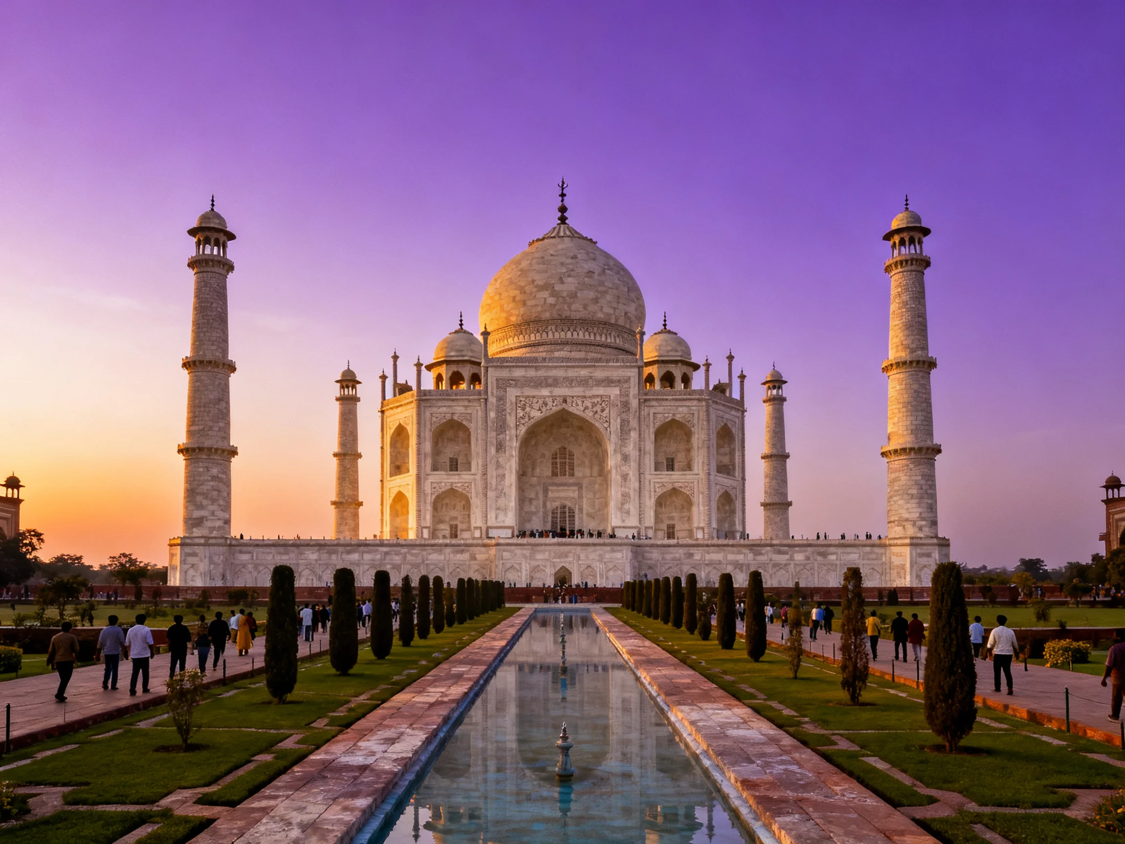 Taj Mahal at sunset with reflecting pool and minarets