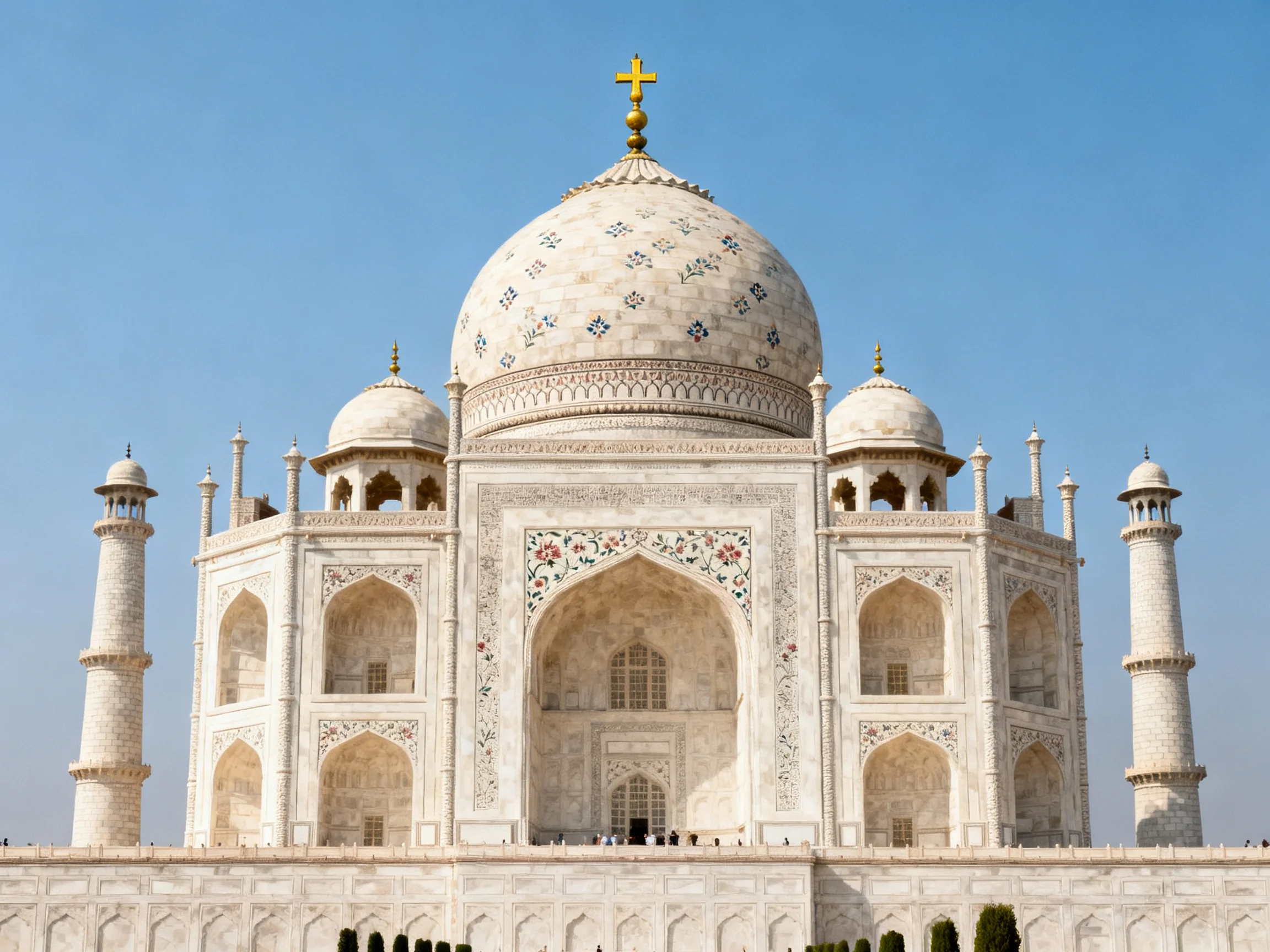 The Taj Mahal: Ornate White Marble Mausoleum Under Clear Blue Sky