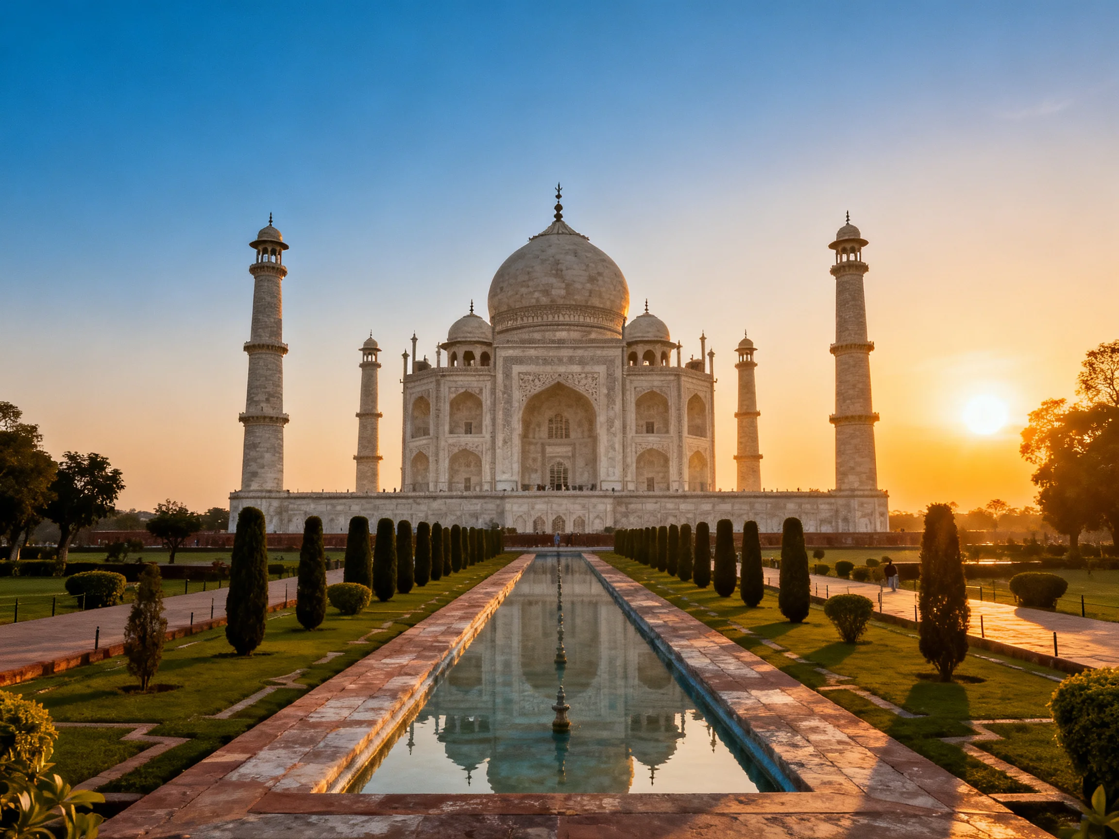 The Taj Mahal at sunset with central dome and four minarets