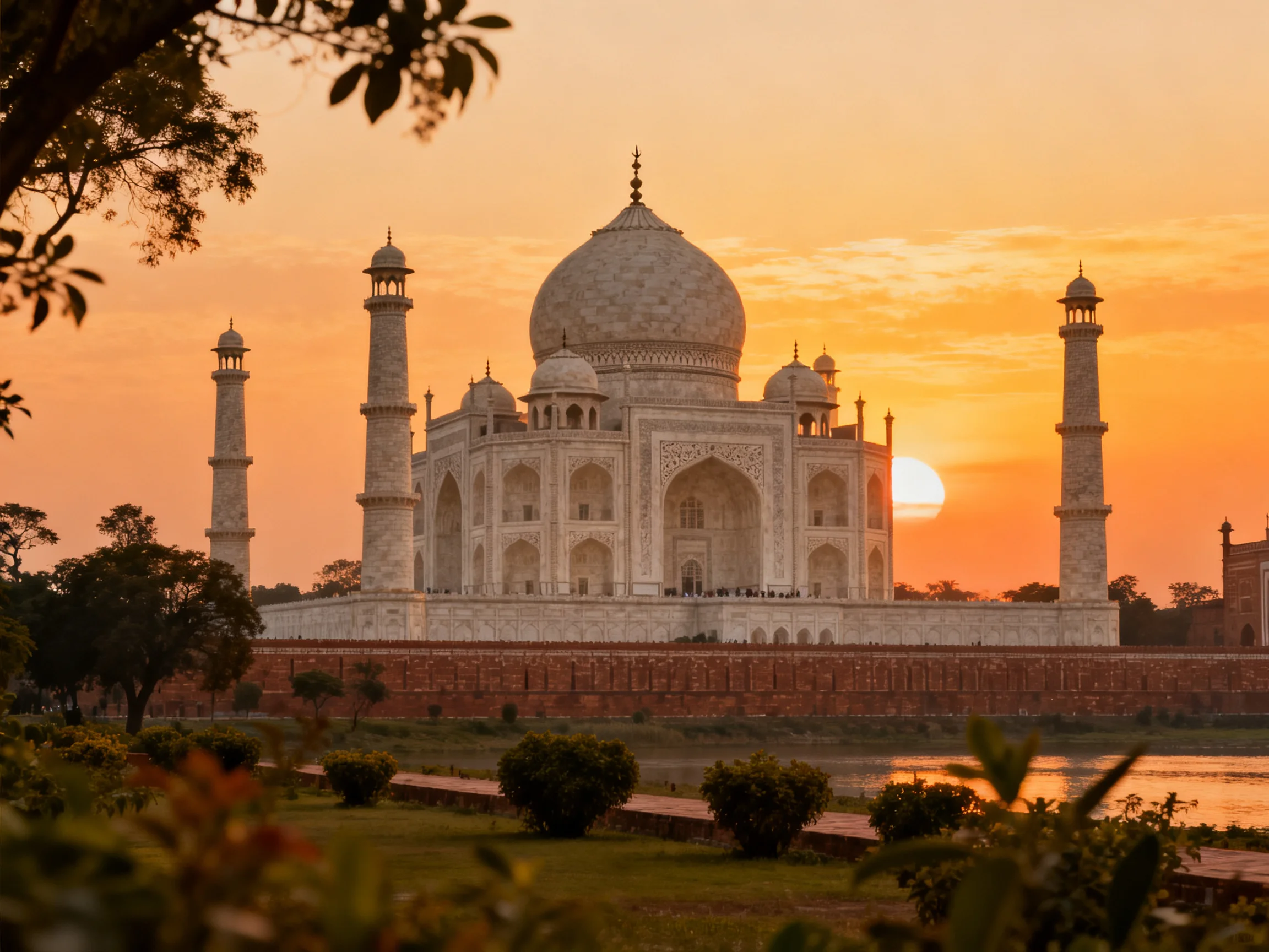 The Taj Mahal glowing under golden sunset with four minarets