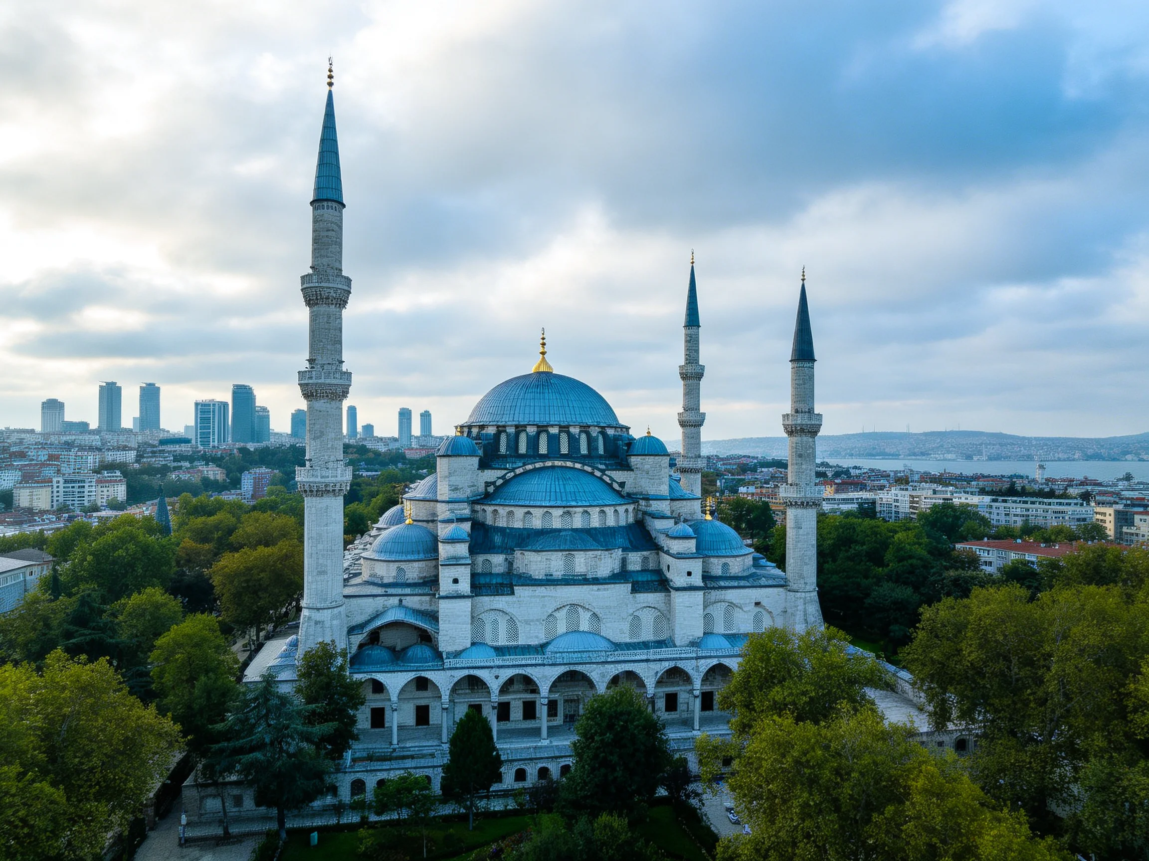 The grand blue-domed mosque with four towering minarets