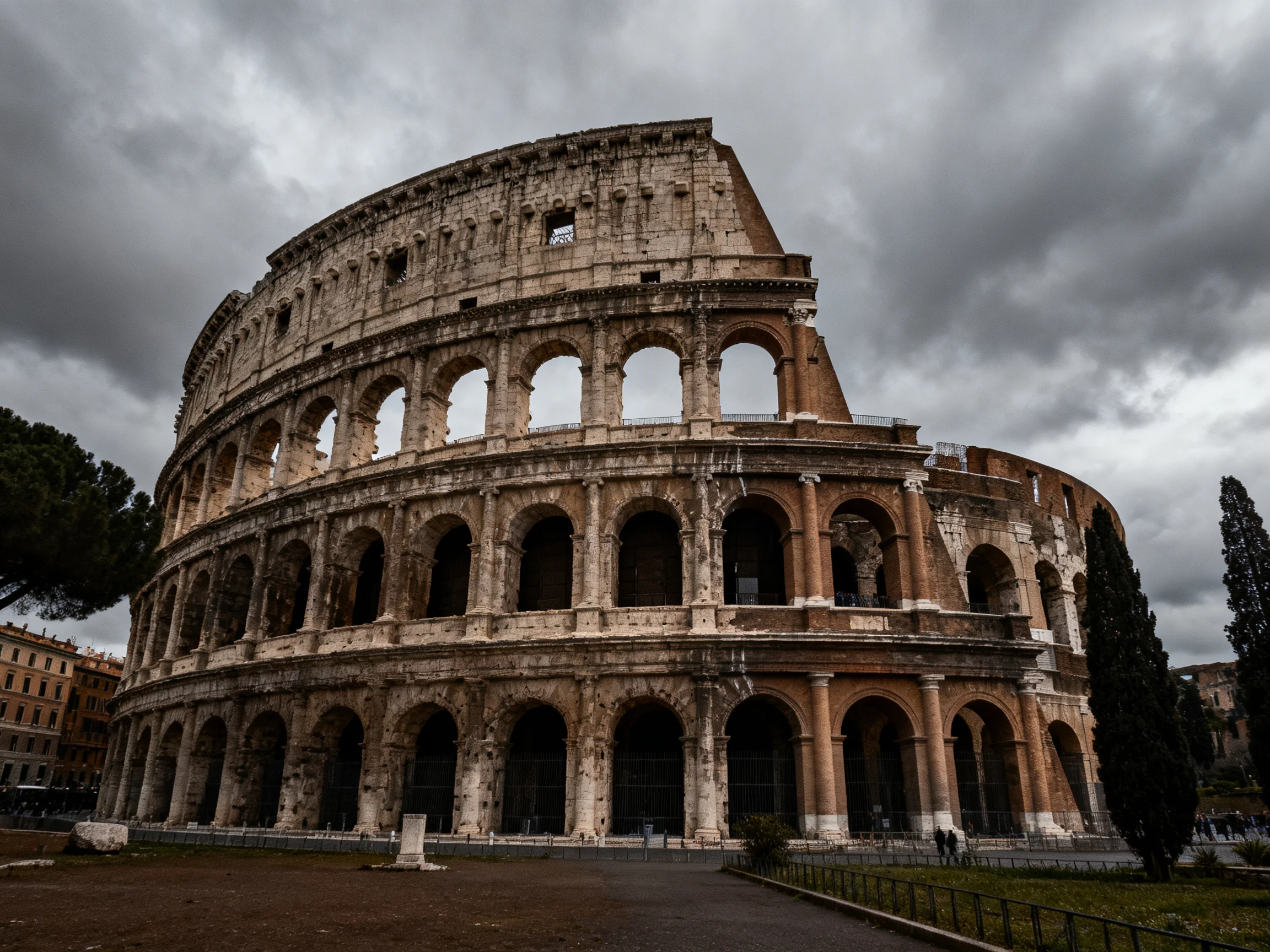 The historic Colosseum under dramatic cloudy skies