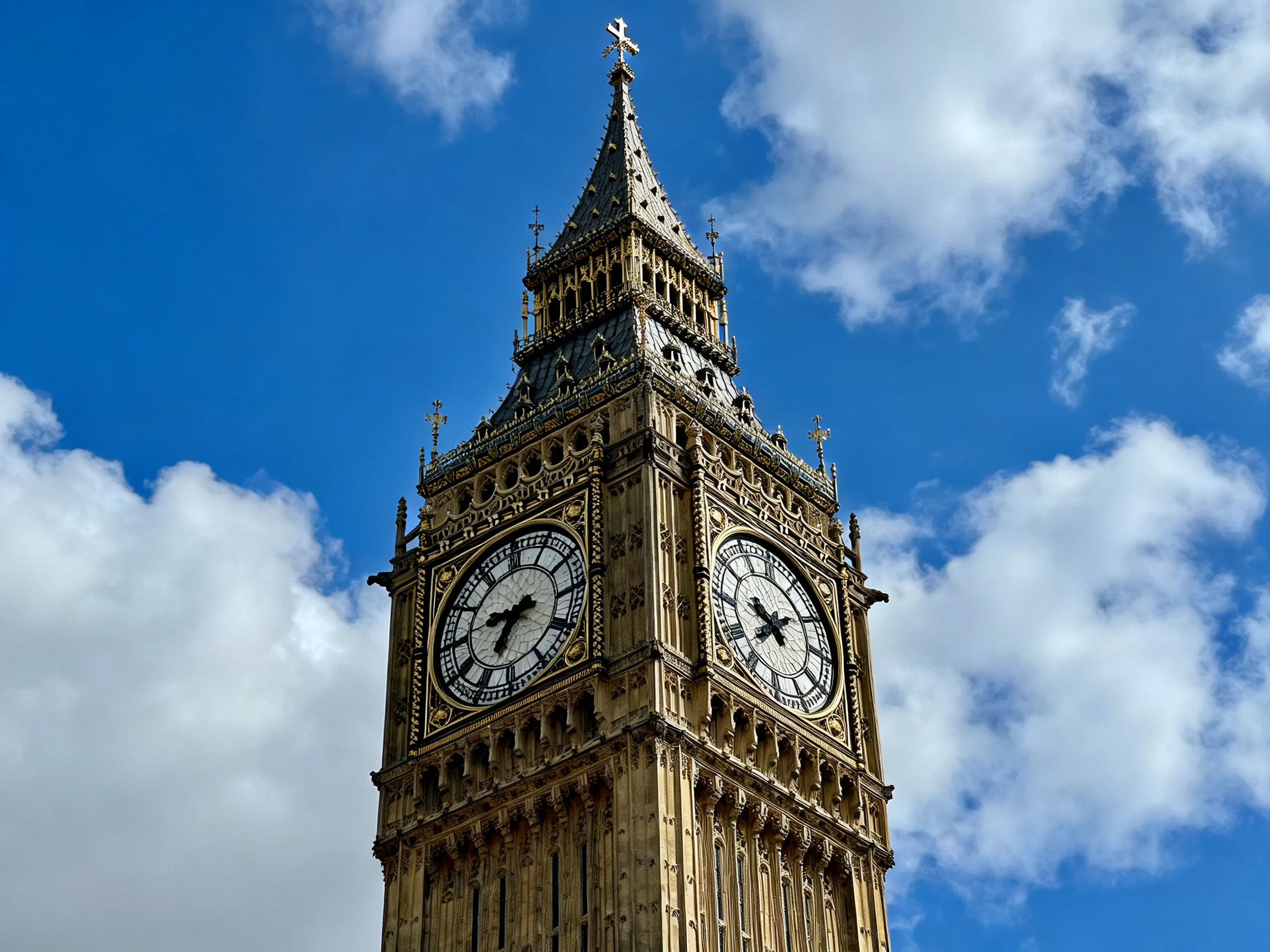 The iconic Big Ben clock tower stands tall under a clear blue sky