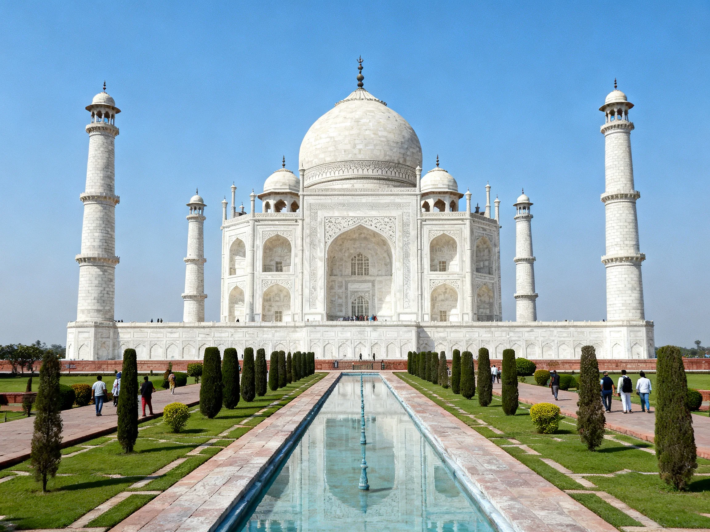 The magnificent white marble Taj Mahal with four minarets and central dome