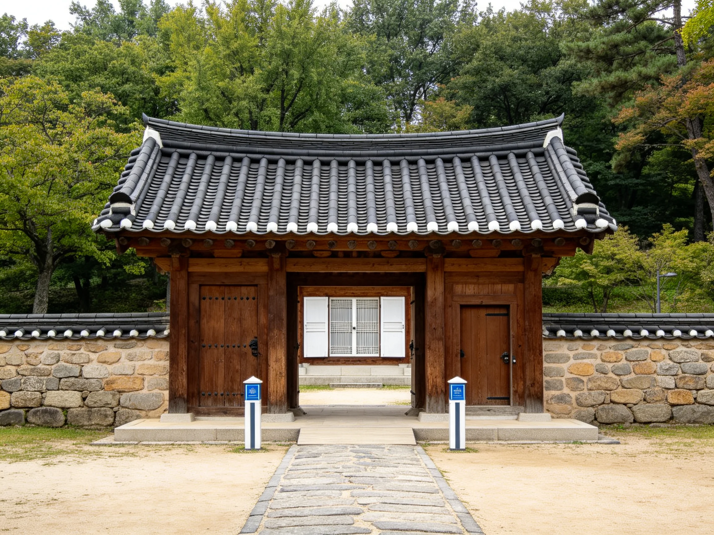 Traditional wooden gateway with tiled roof near stone walls