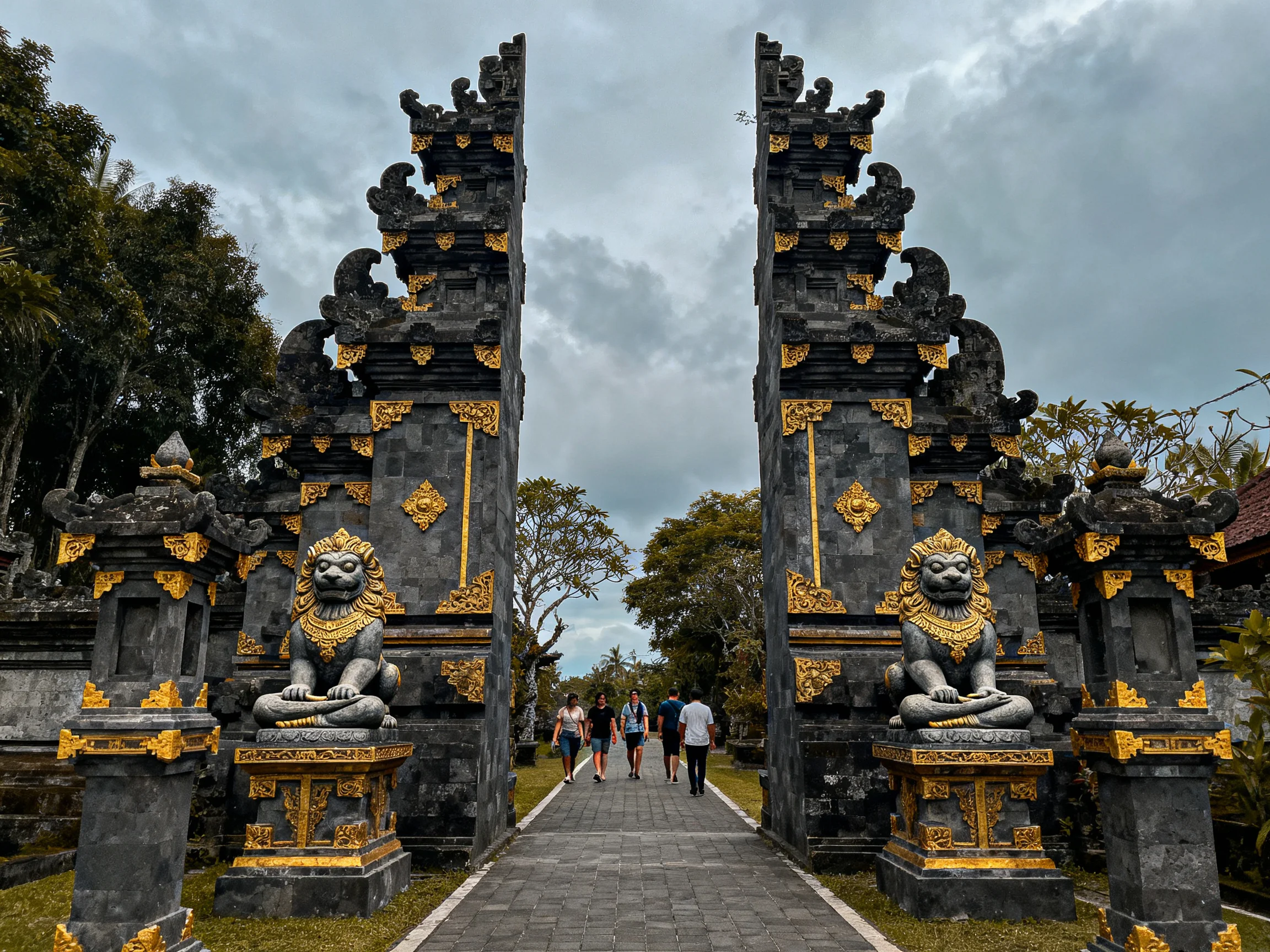Two ornate stone gates with golden details frame a pathway
