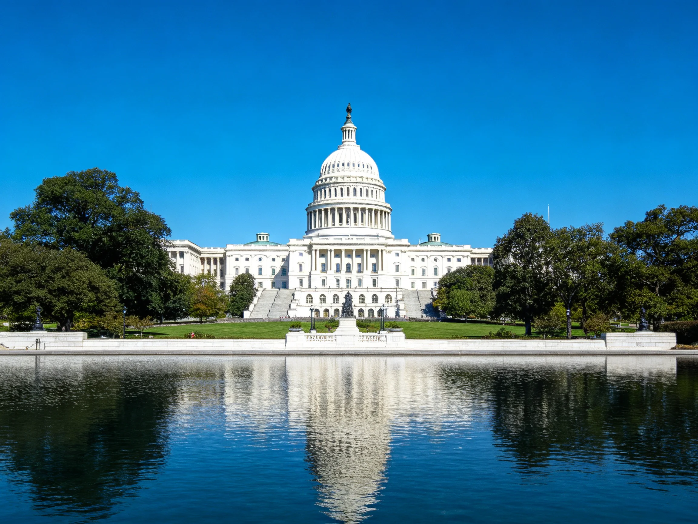 United States Capitol Building with Reflective Water and Lush Greenery