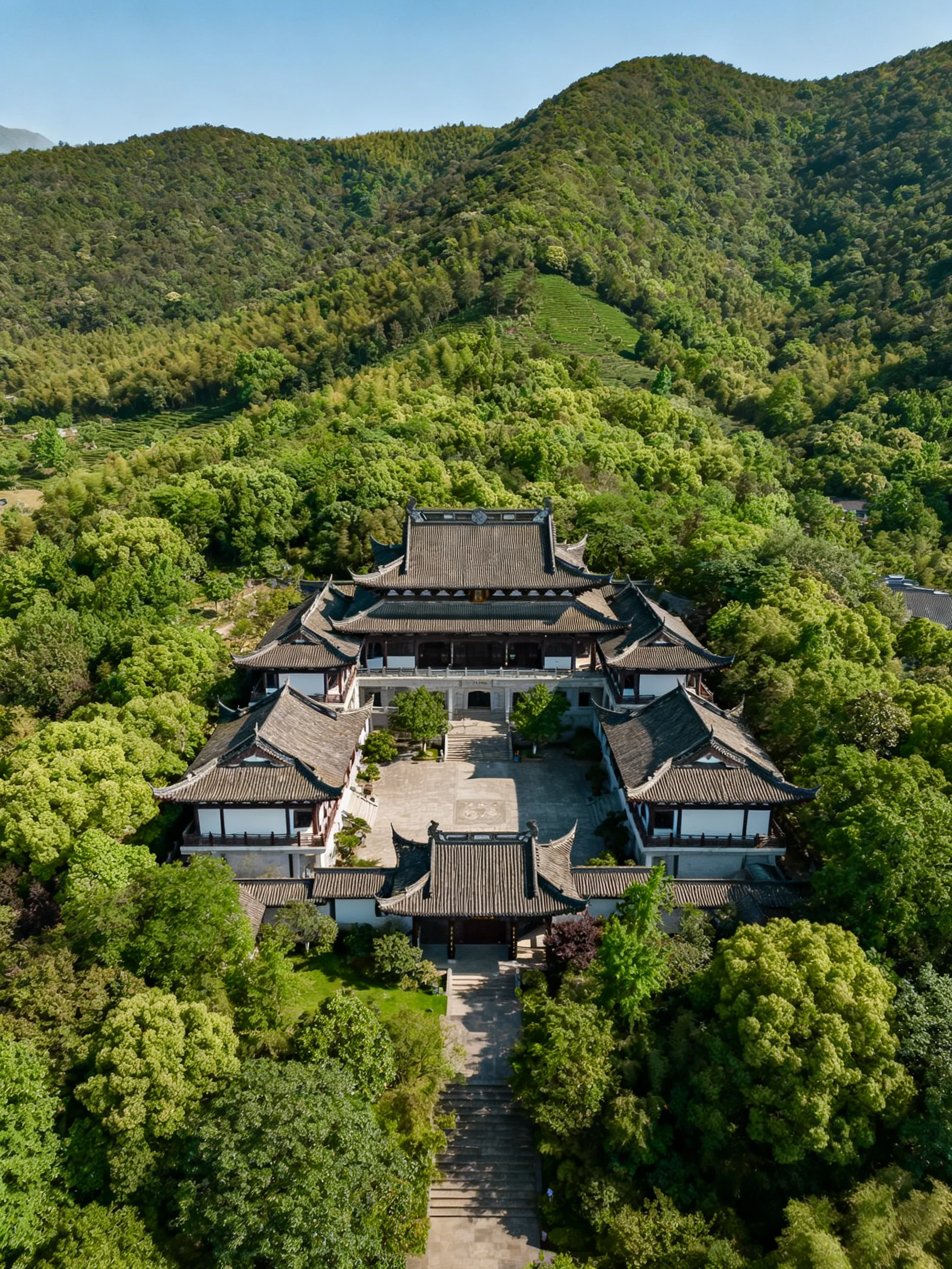 A grand ancient temple complex amid lush green forested hills