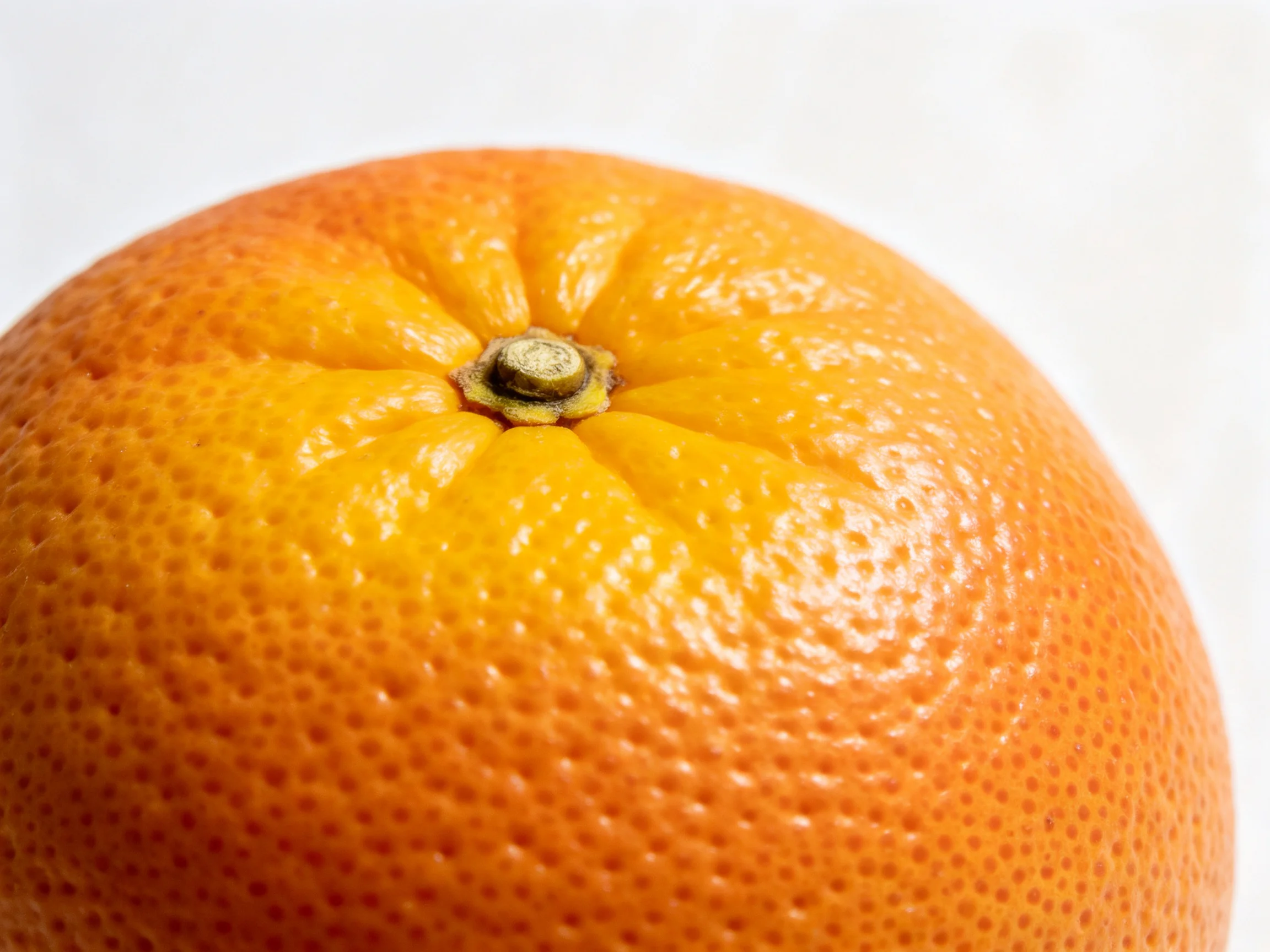 A vibrant orange citrus fruit with detailed textured peel