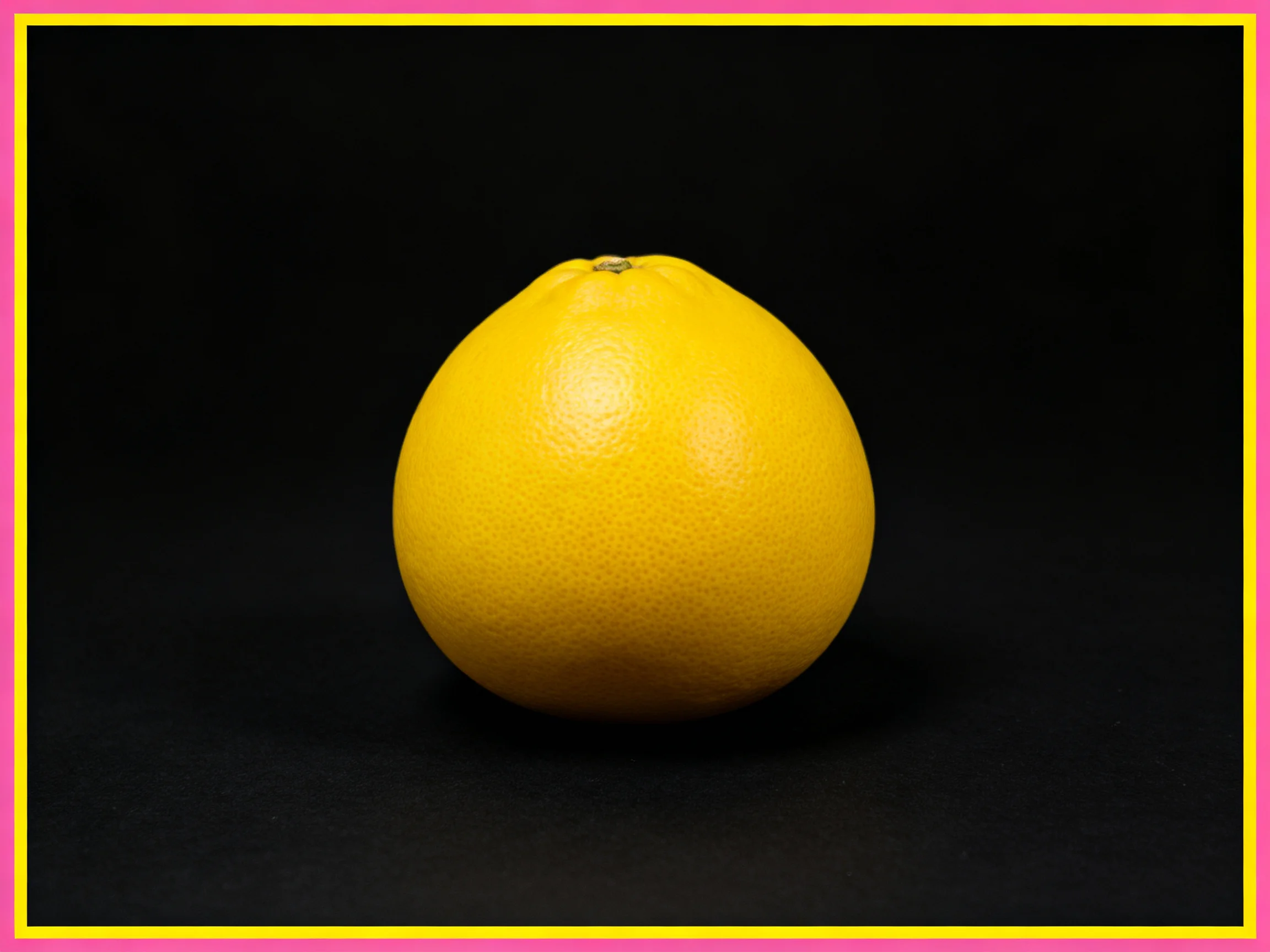 Bright yellow citrus fruit centered on black background with colored borders