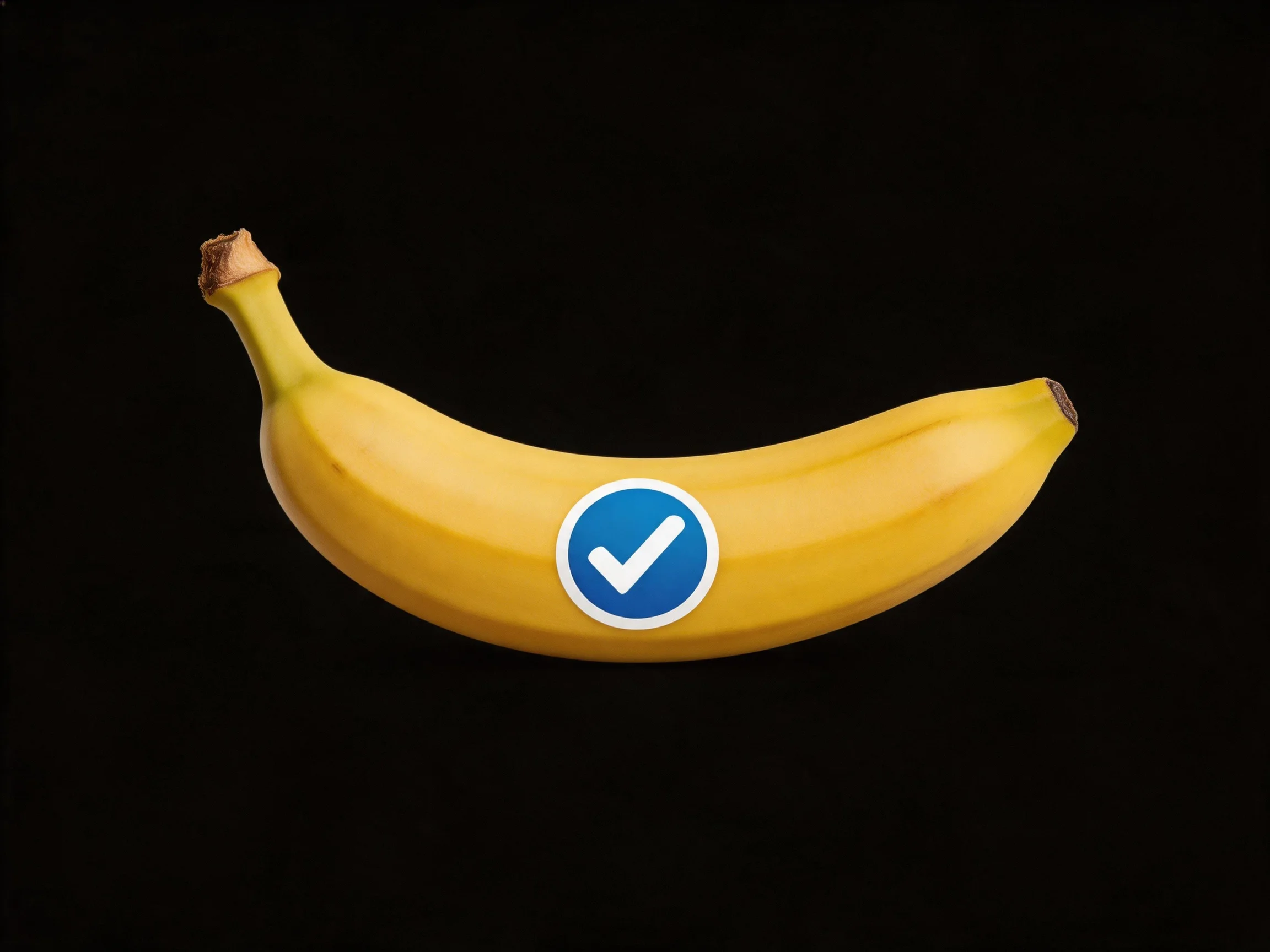 Ripe yellow banana with blue checkmark icon on solid black background