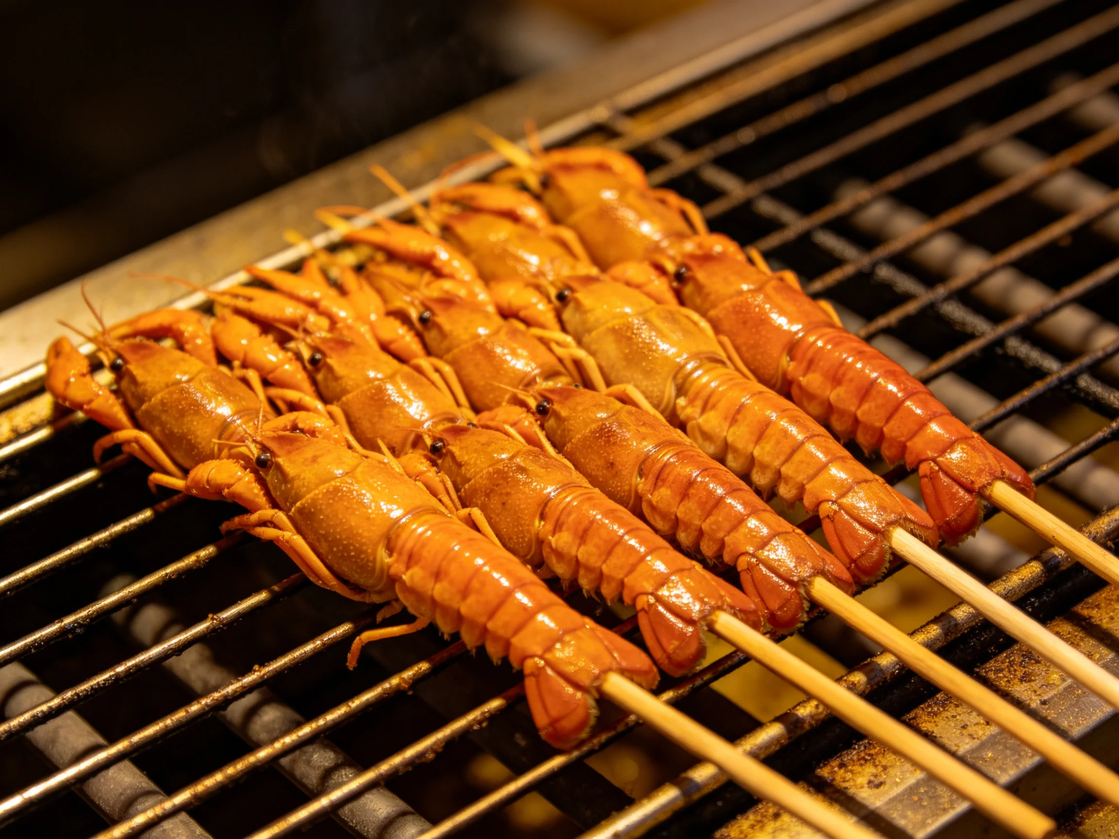 Golden crayfish skewers grilled on a metal barbecue rack