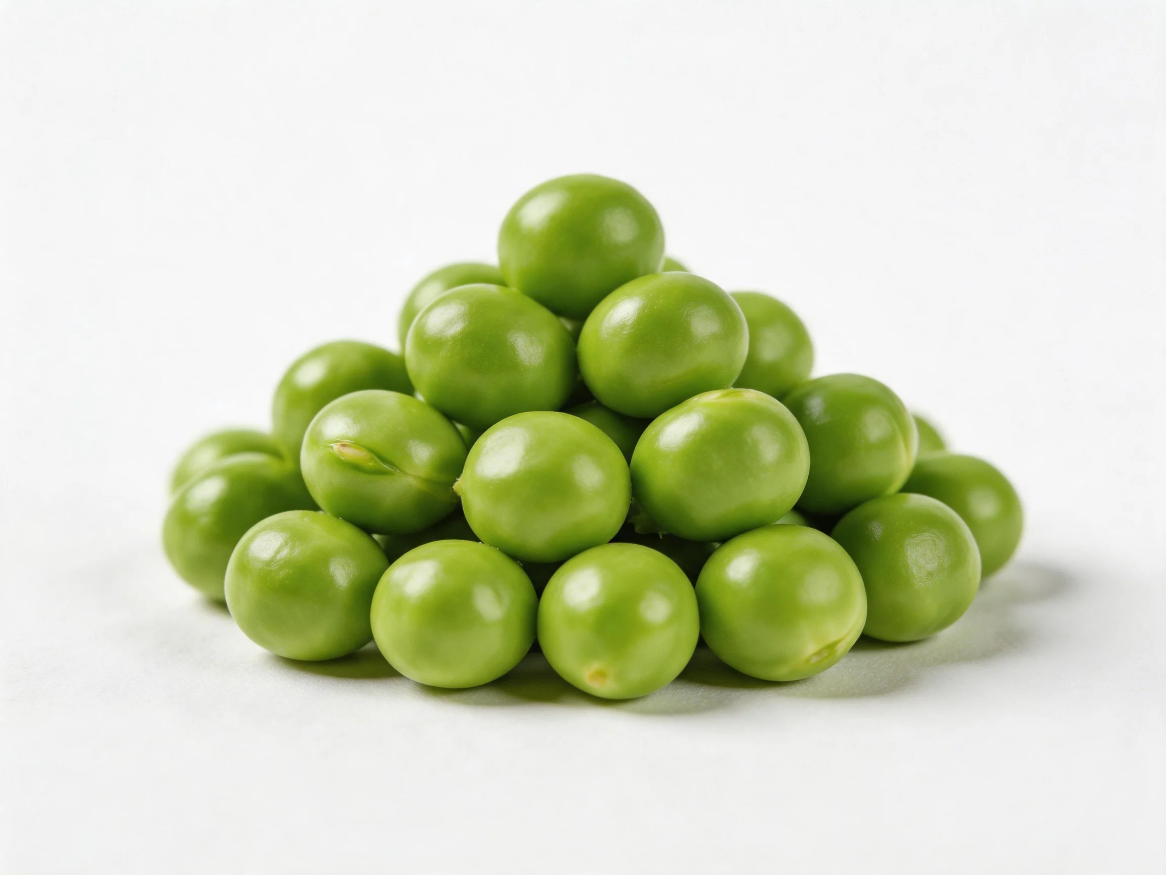 A pyramid - shaped pile of fresh green peas on a white background