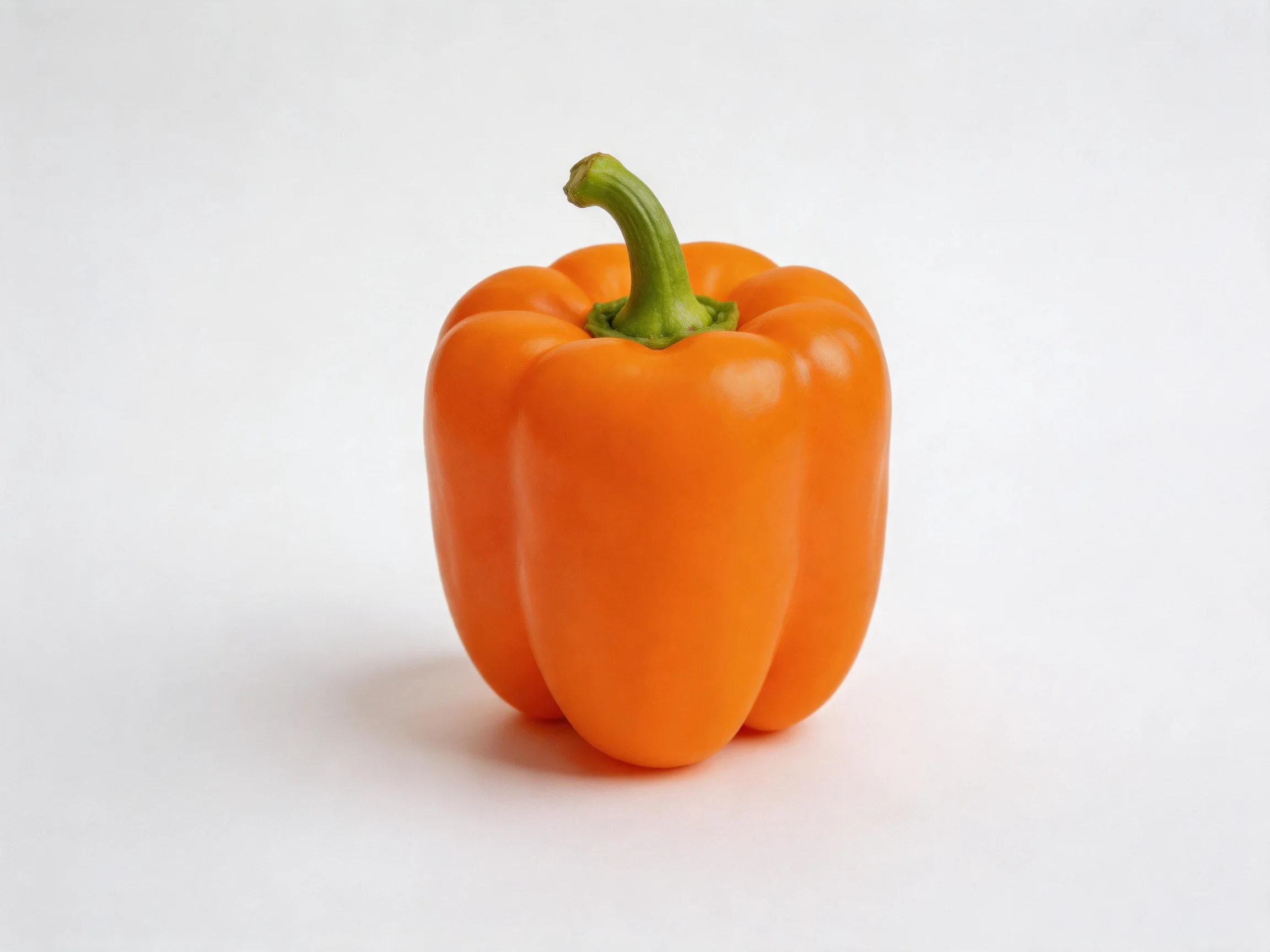 A single vibrant orange bell pepper centered on a white background