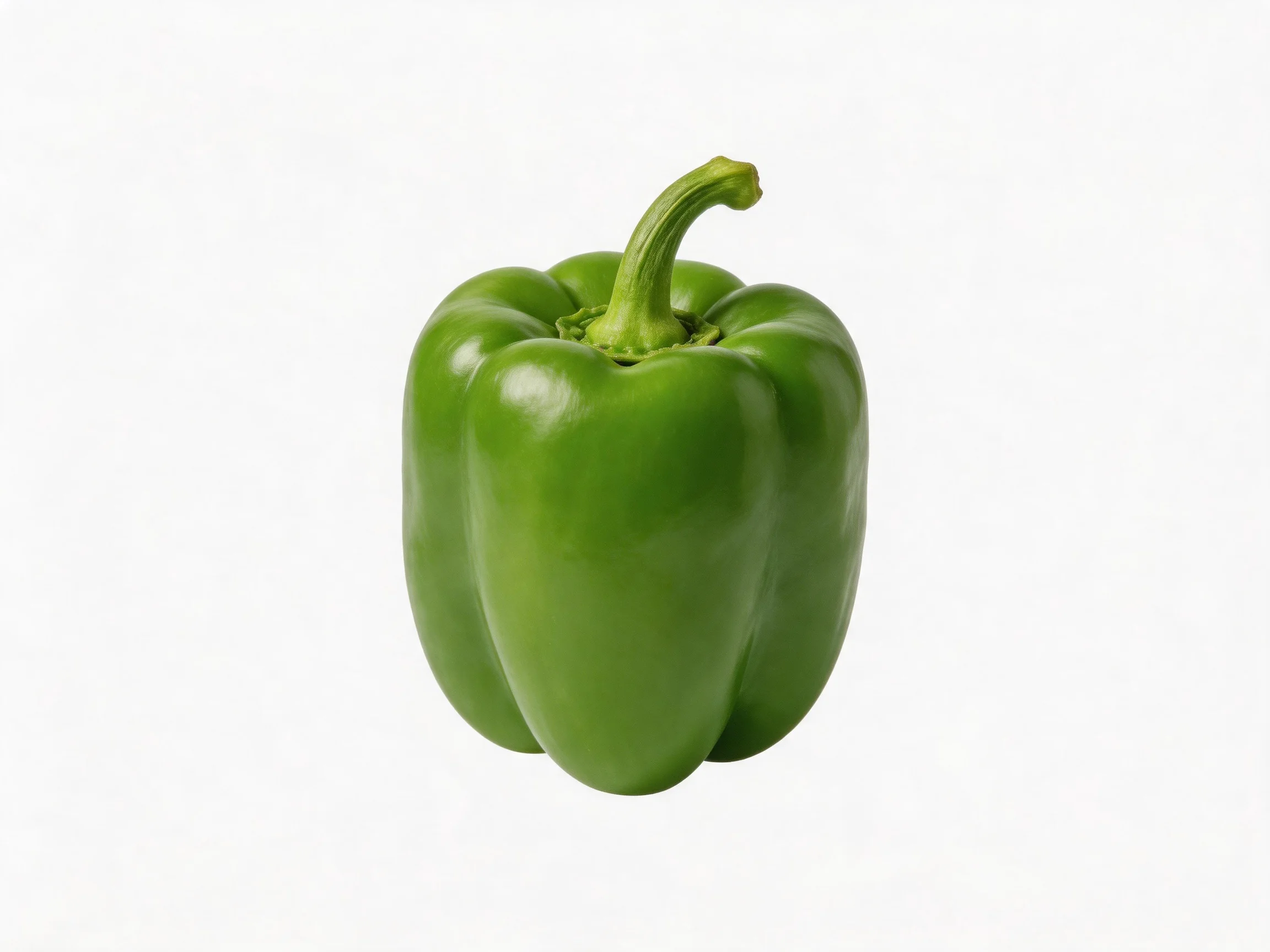 A vibrant green bell pepper displayed against a stark white background