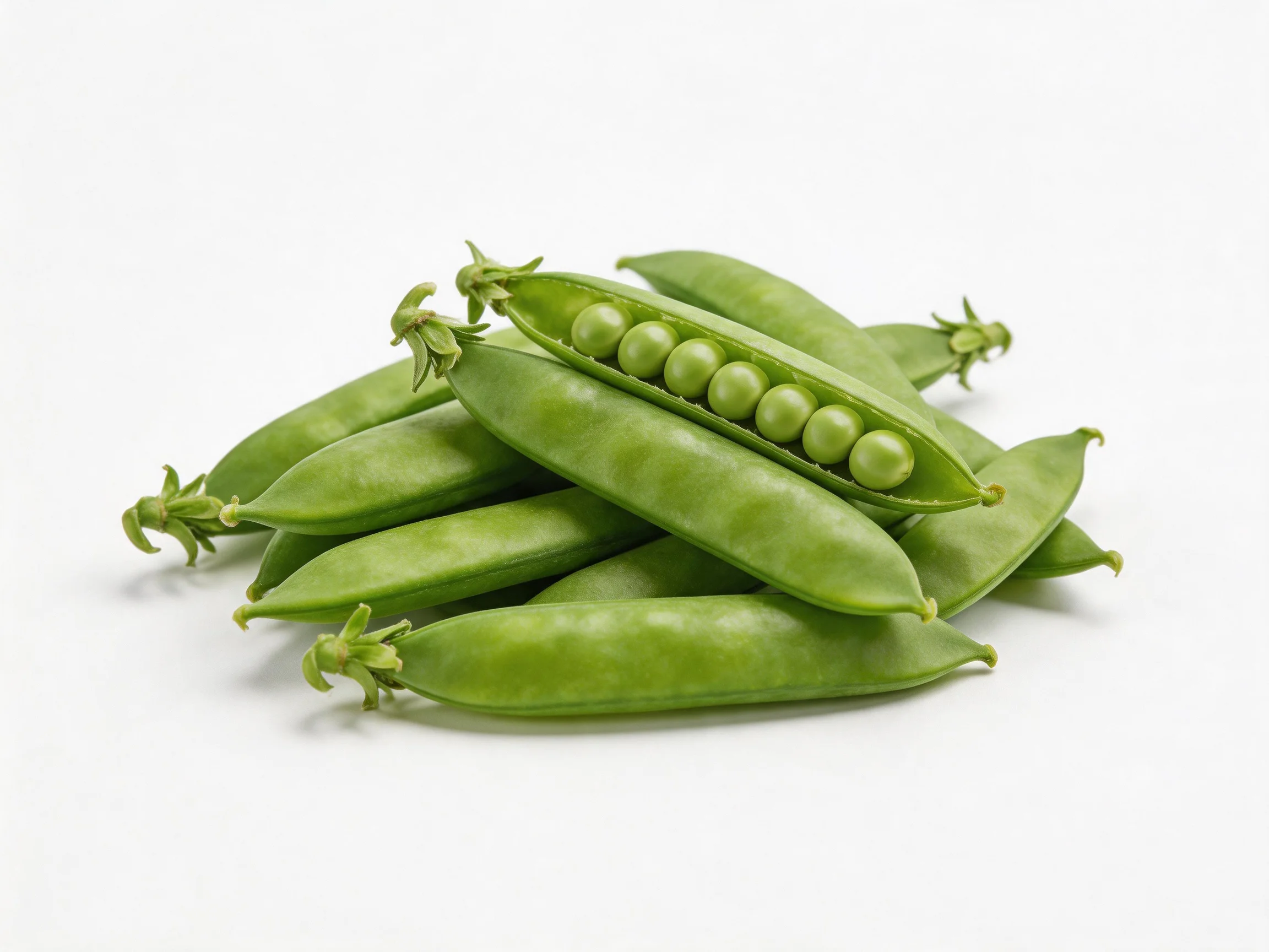 Fresh green pea pods stacked, one pod open displaying peas