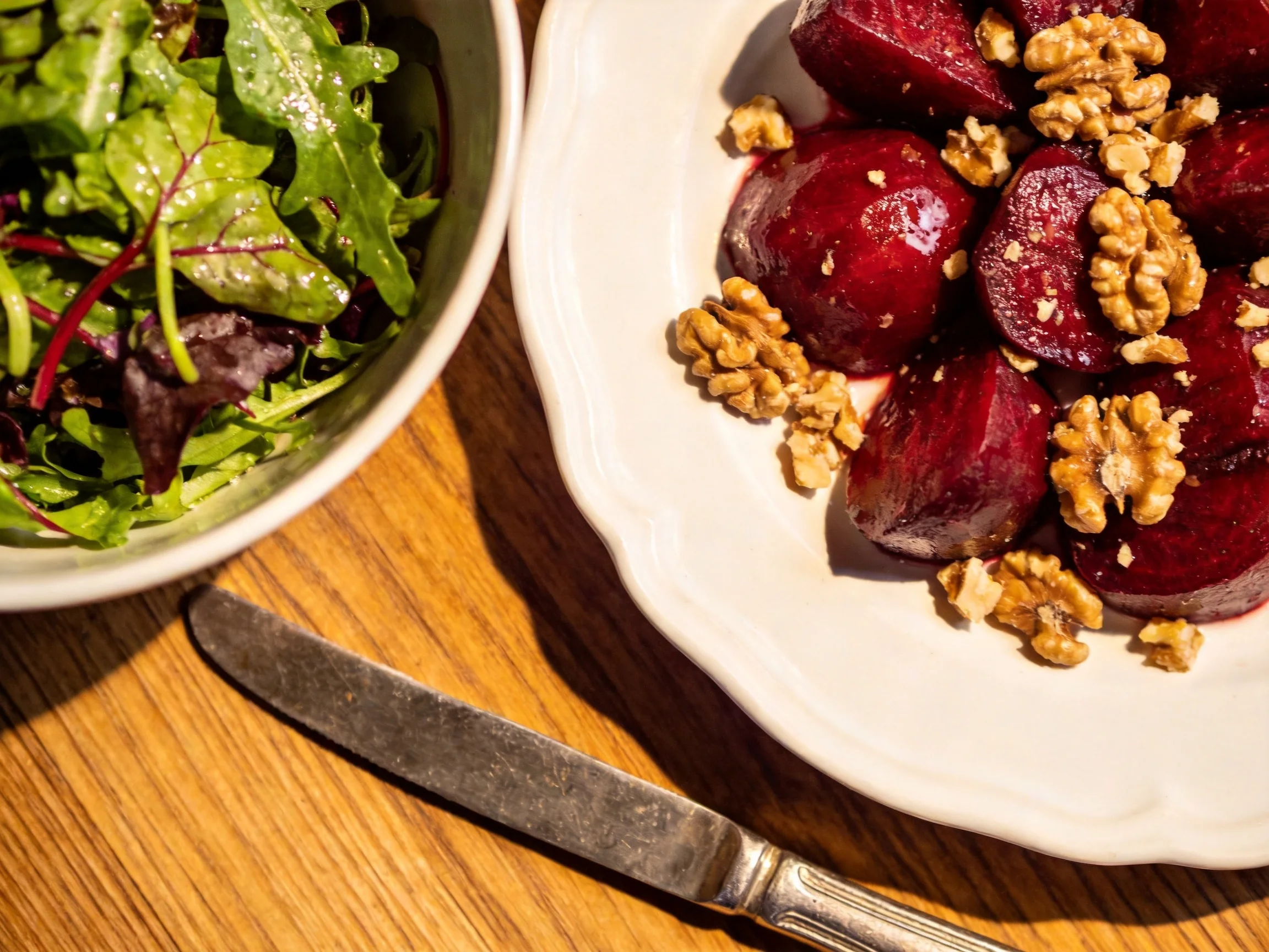 Roasted Beet & Walnut Dish Near Mixed Greens Salad