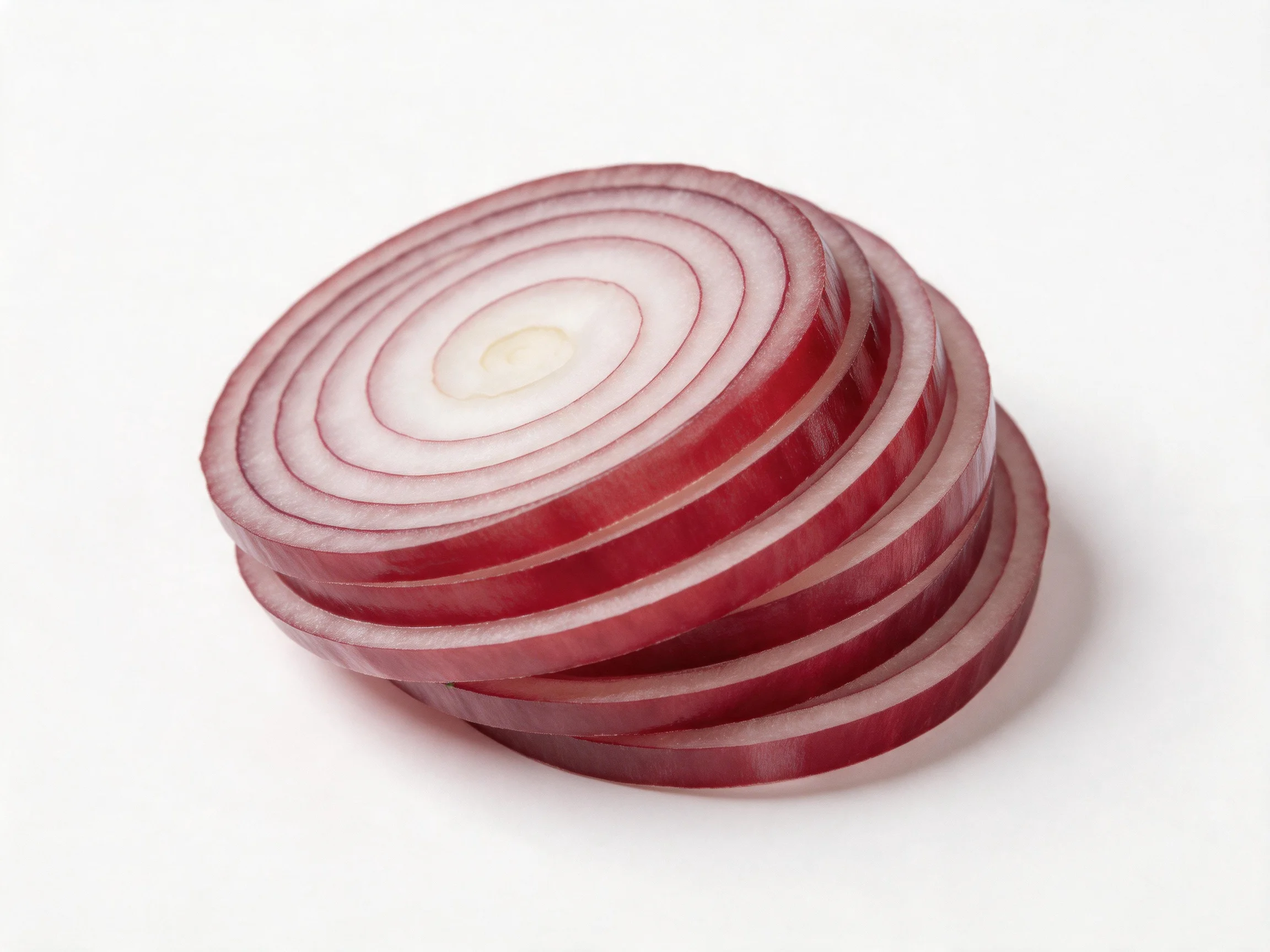 Sliced red onion rings stacked in a layered formation